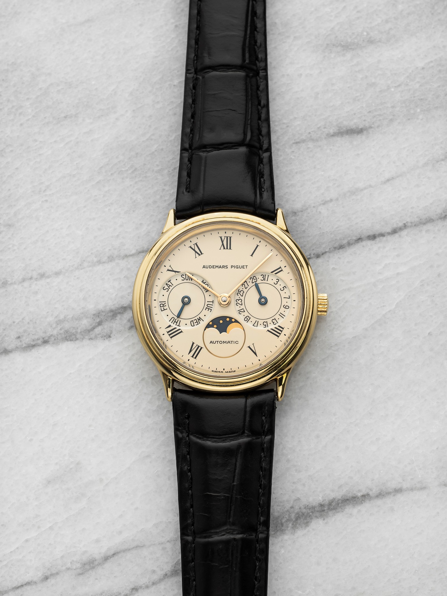 May be an image of wrist watch and text