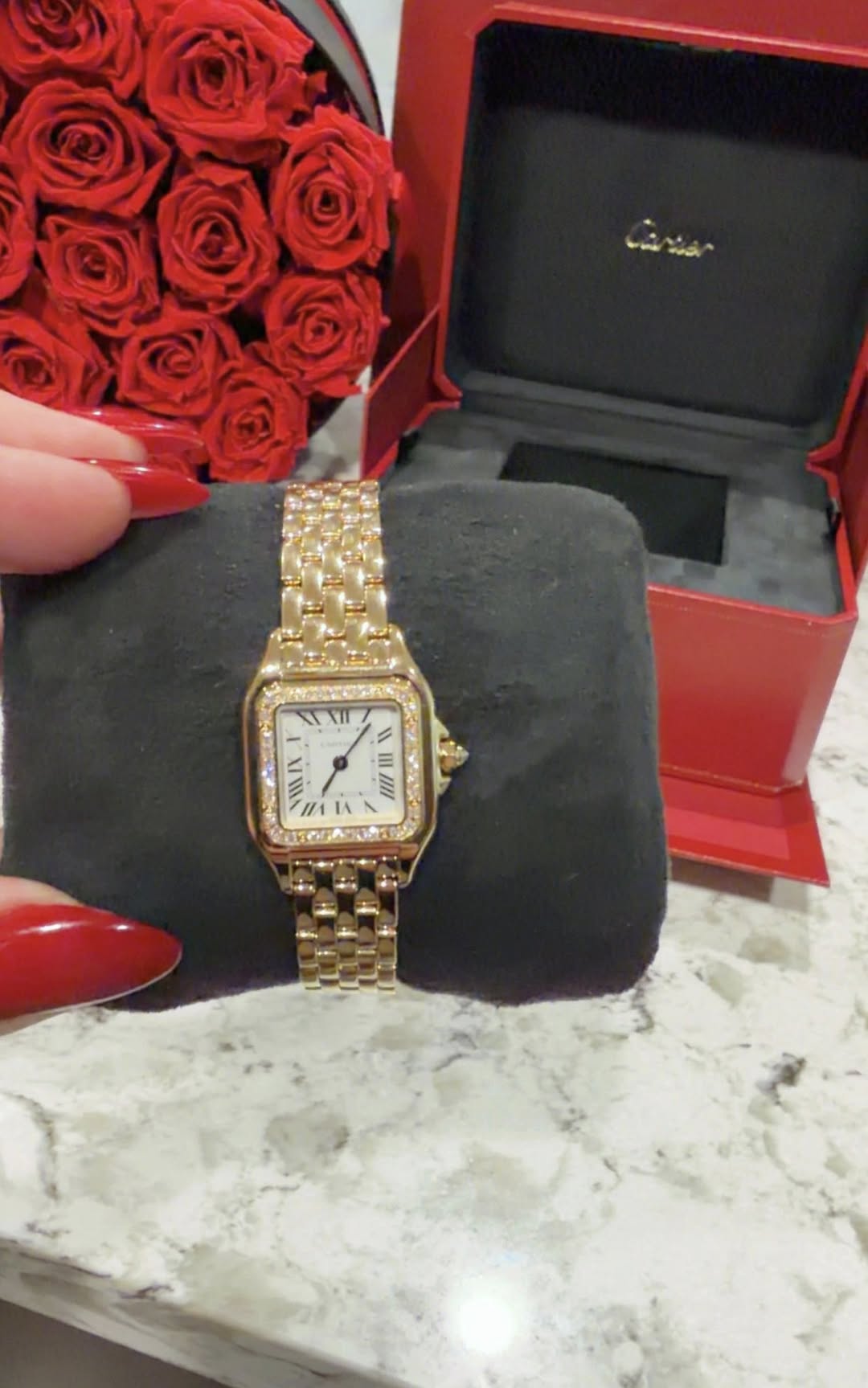 May be an image of wrist watch and text