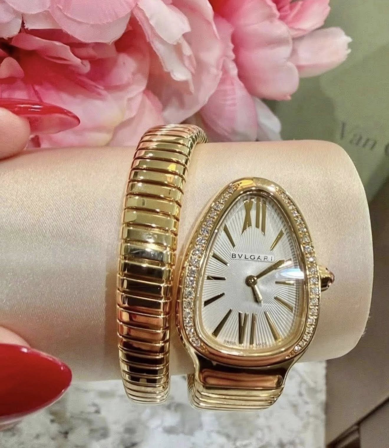 May be an image of wrist watch and jewelry