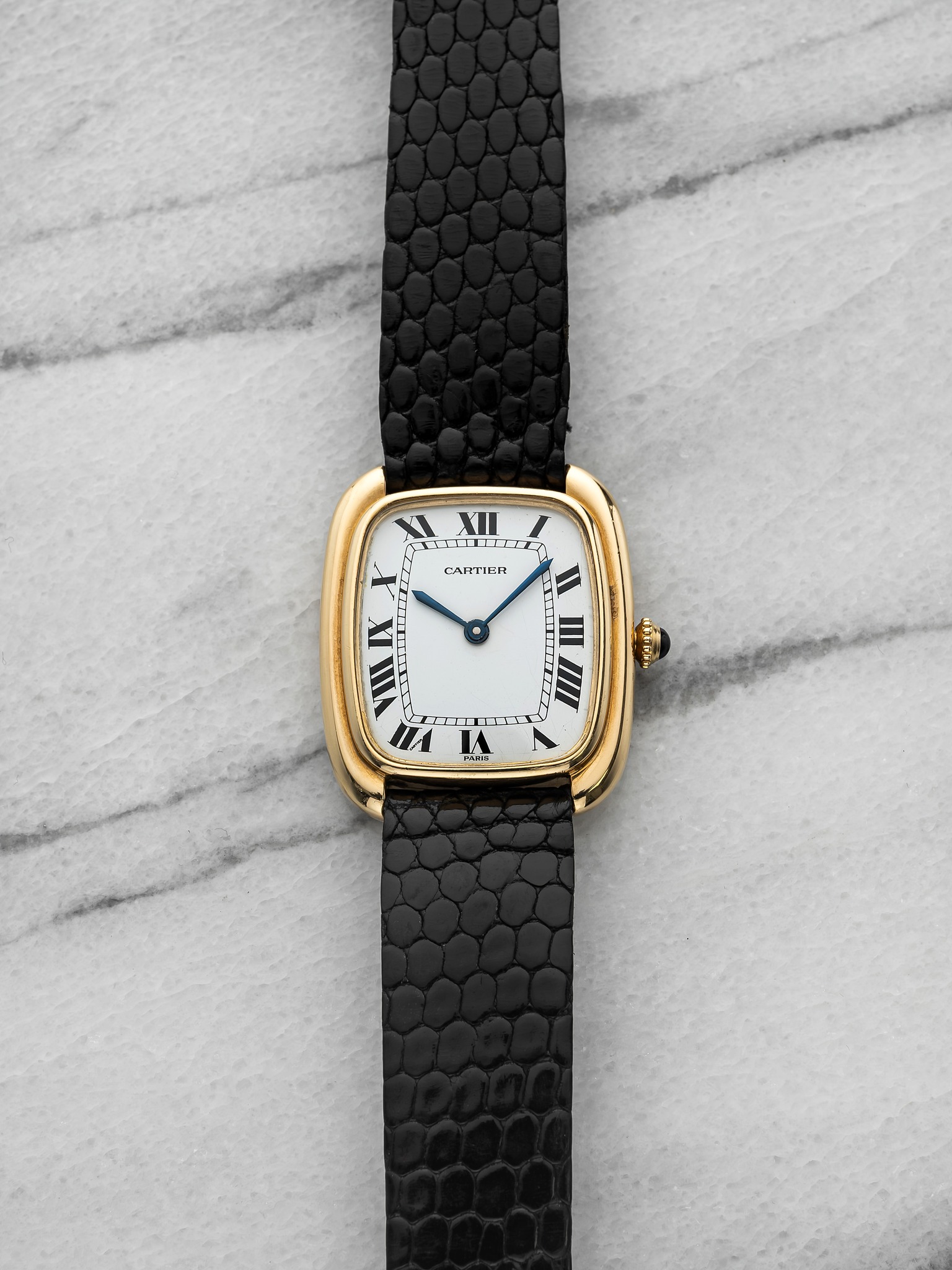 May be an image of wrist watch and leather