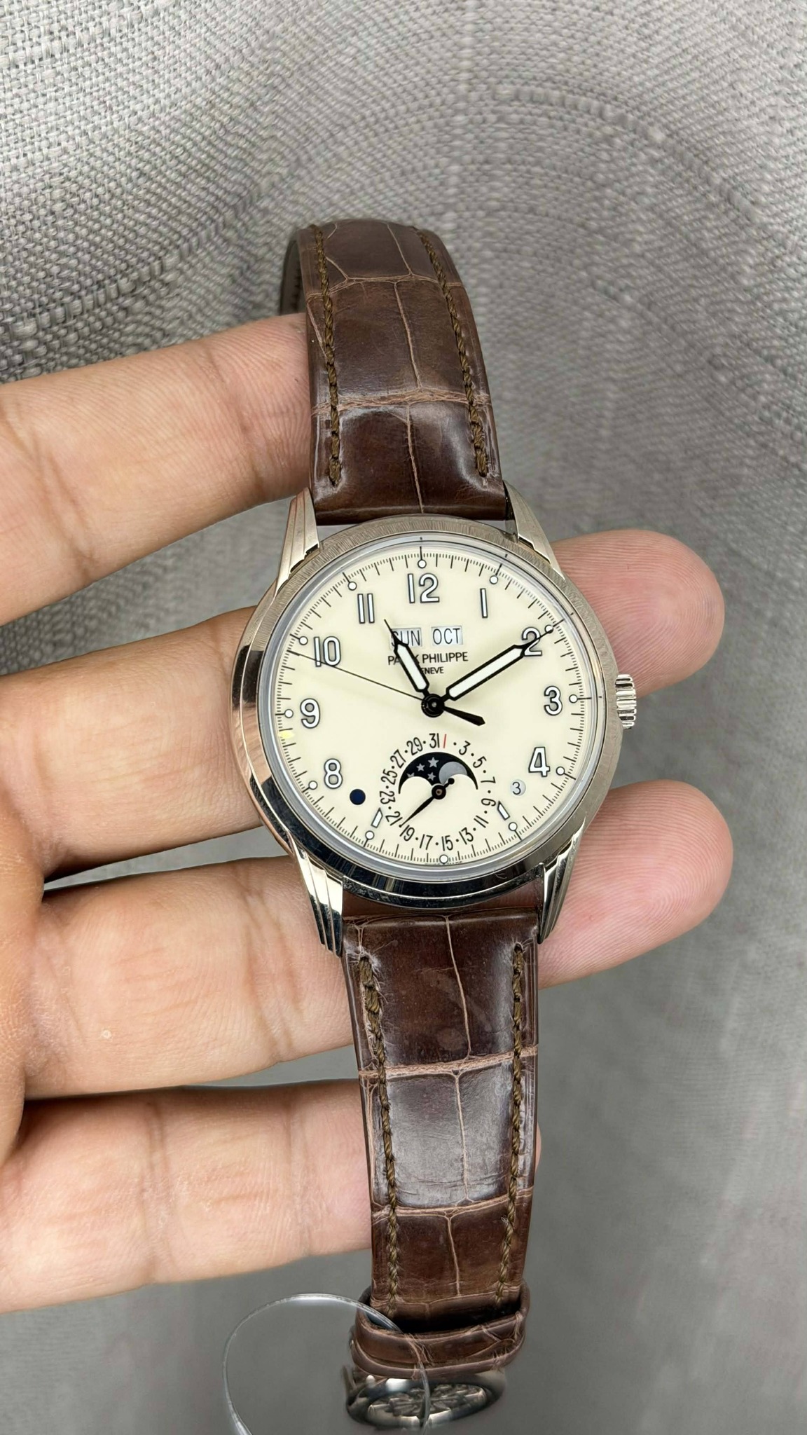 May be an image of wrist watch and text