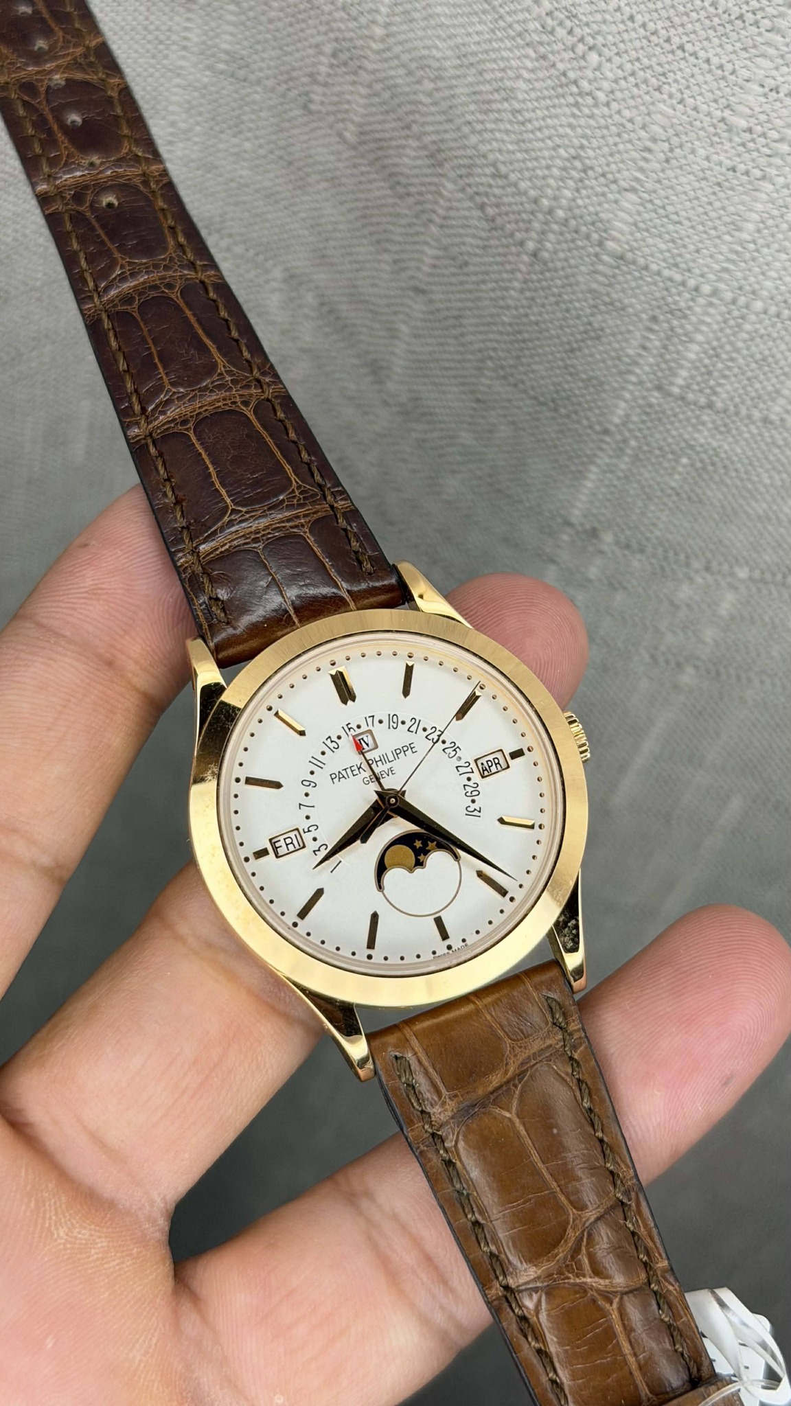 May be an image of wrist watch and text