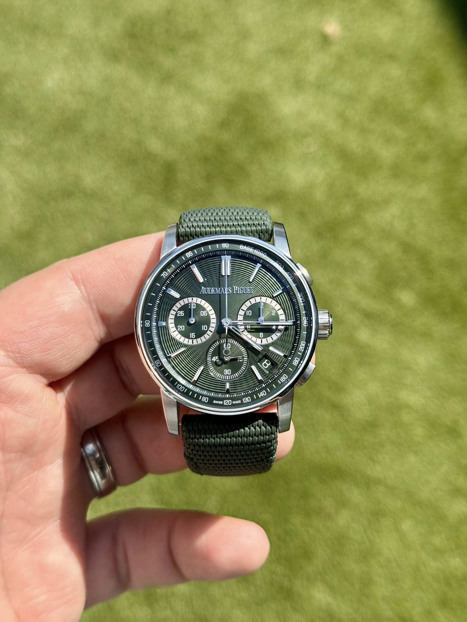 May be an image of wrist watch and text