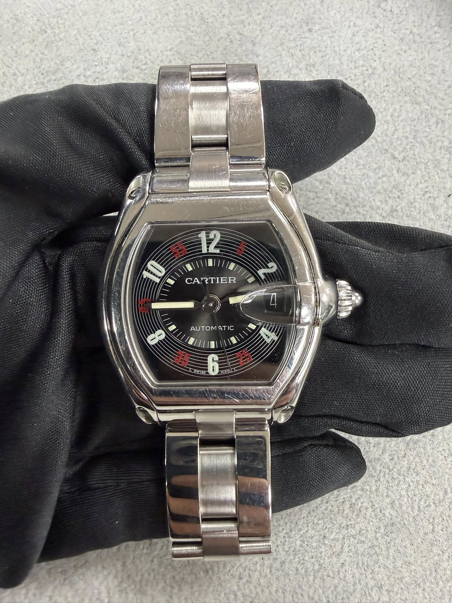 May be an image of wrist watch and text that says '12 10 - CARTIER 2 AUTOM T IC I0 ER 6'