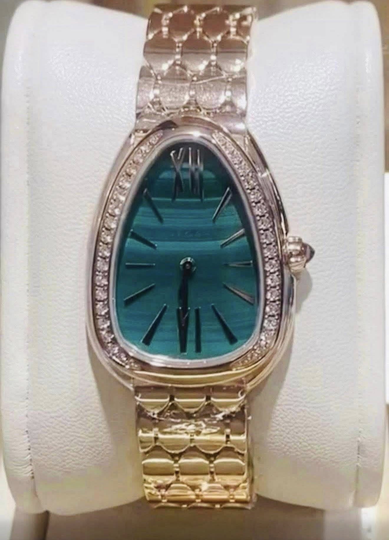 May be an image of jewelry, wrist watch and text