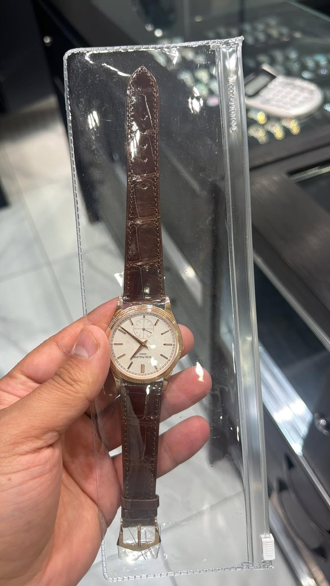May be an image of wrist watch and text