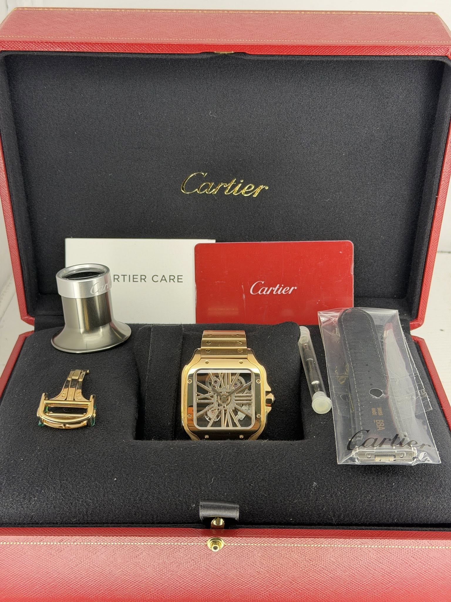 May be an image of lighter and text that says 'Cartier tier RTIER RTIERCARE CARE Cartier'