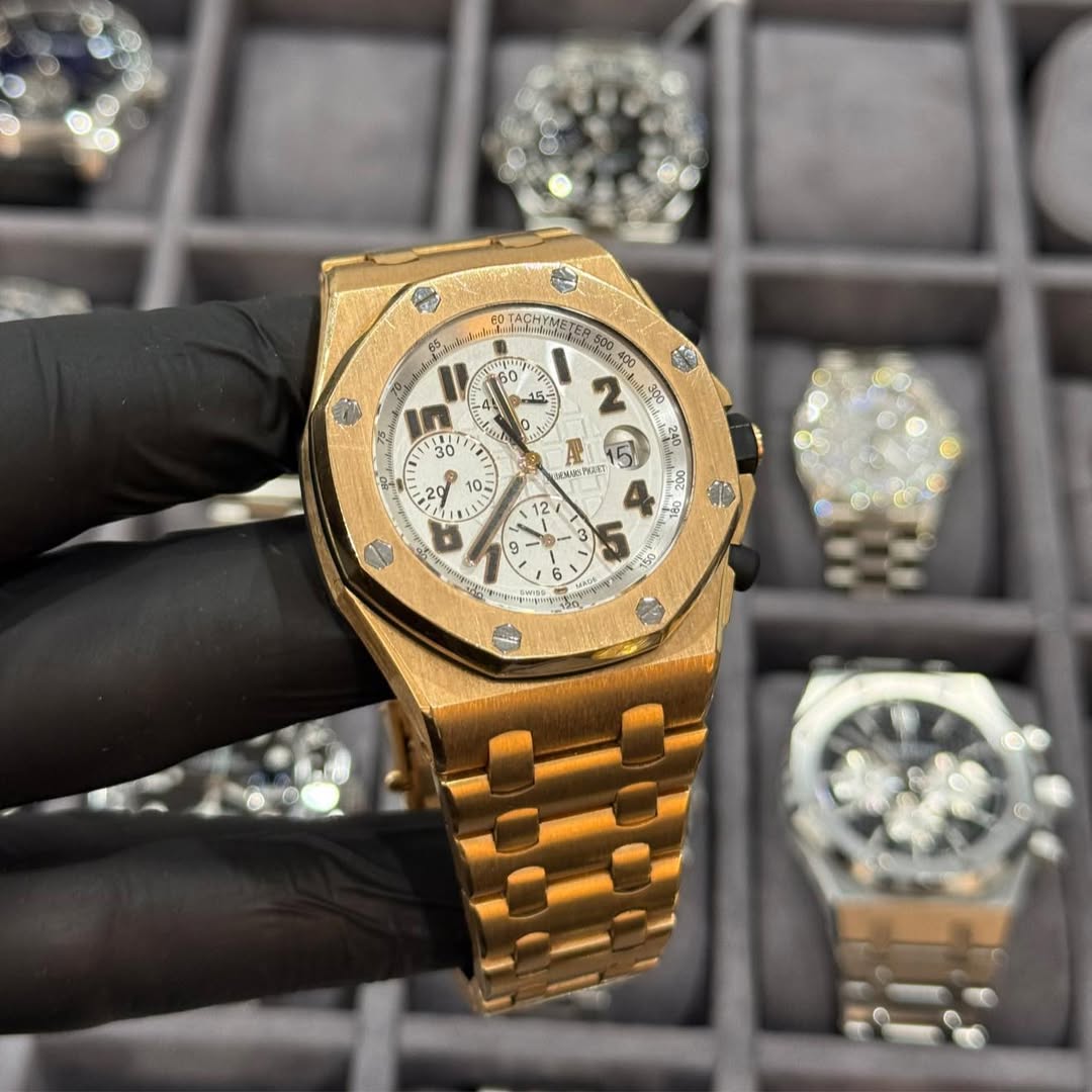 May be an image of wrist watch and text