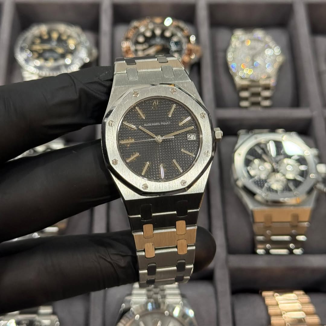May be an image of wrist watch and text