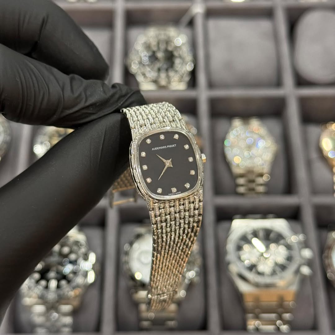 May be an image of wrist watch and text