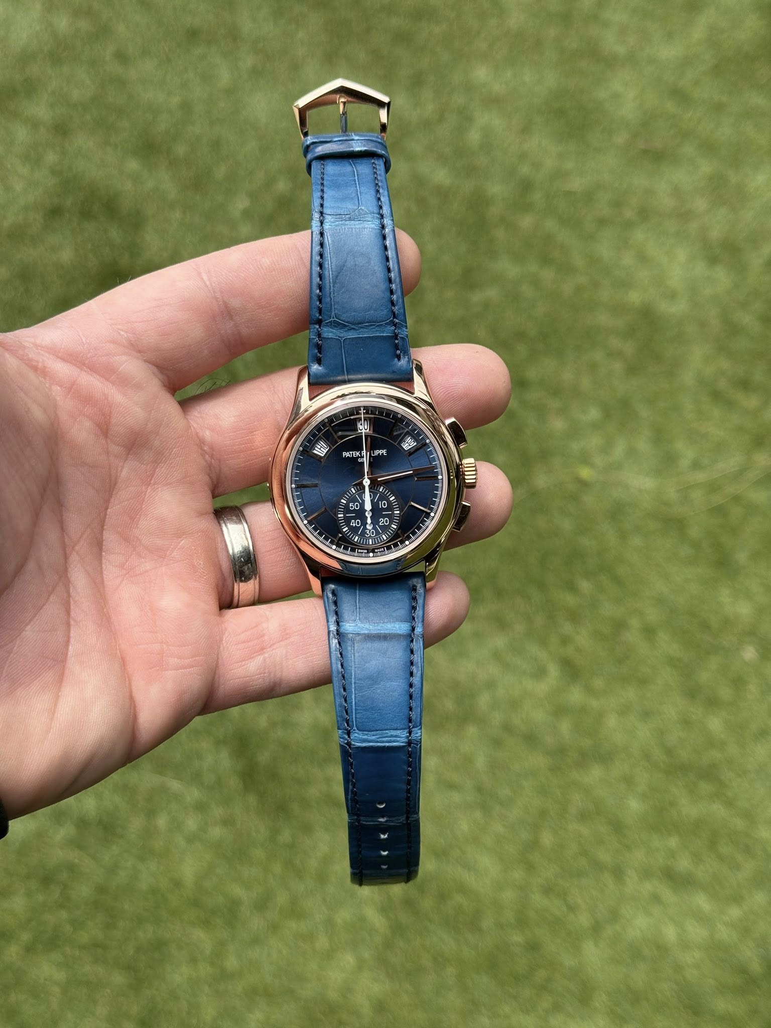 May be an image of wrist watch and text
