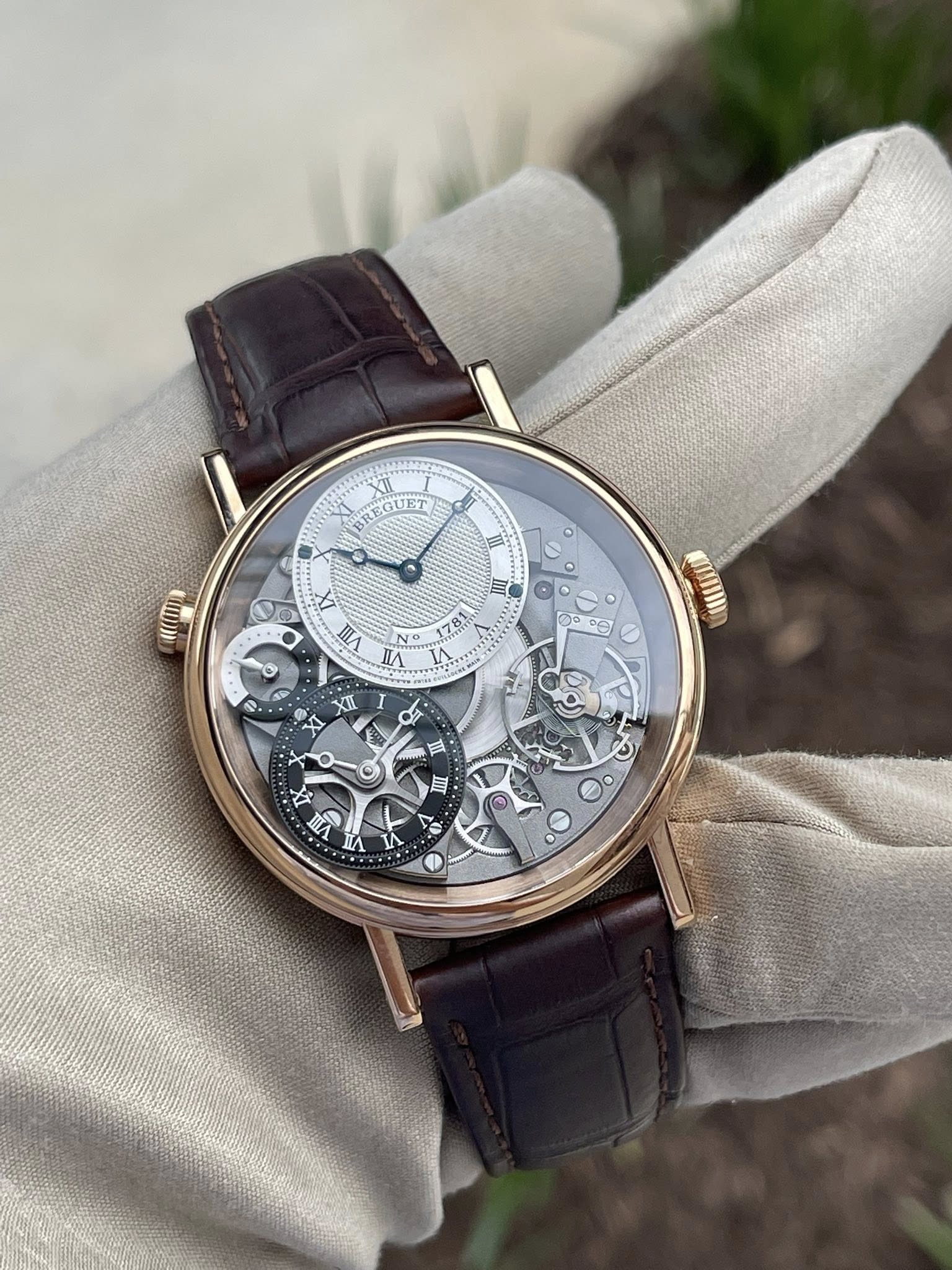 May be an image of wrist watch and text that says 'XII BREGUET II De m ा VII NO c0 81 7 GP ၁၈၅ දෙ 4O'