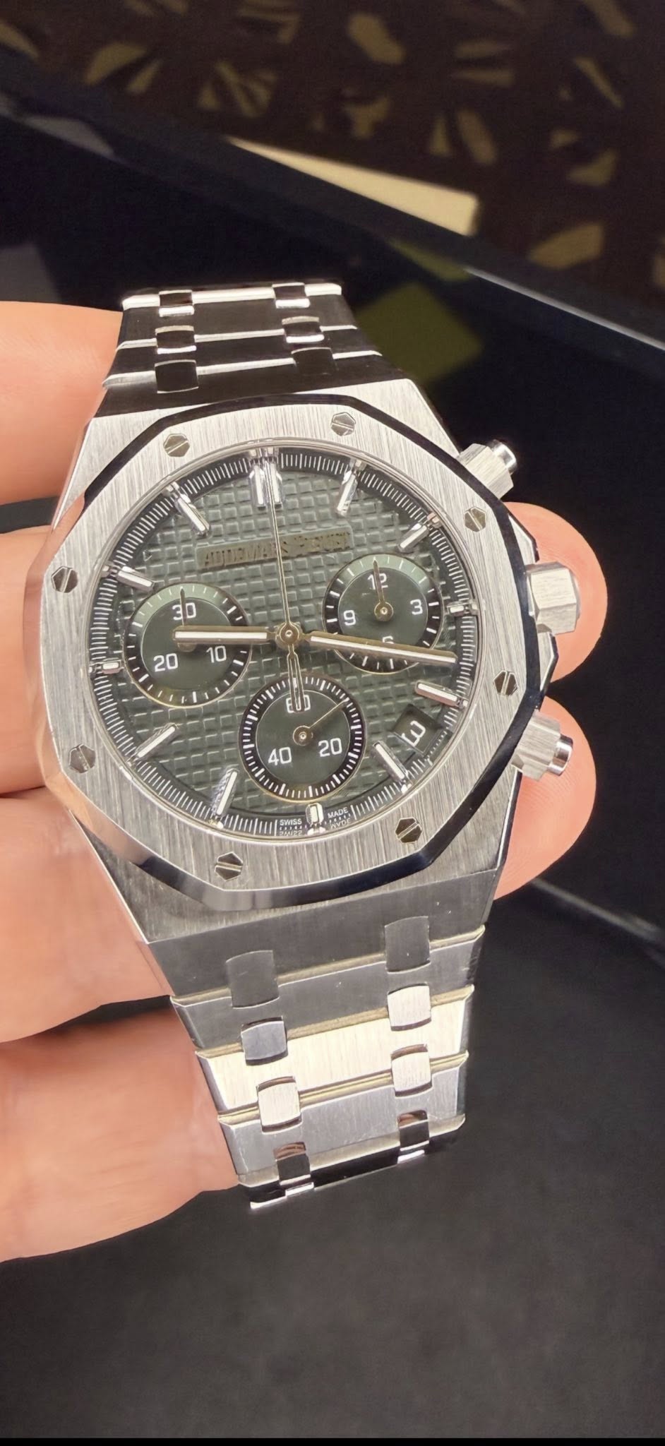 May be an image of wrist watch and text