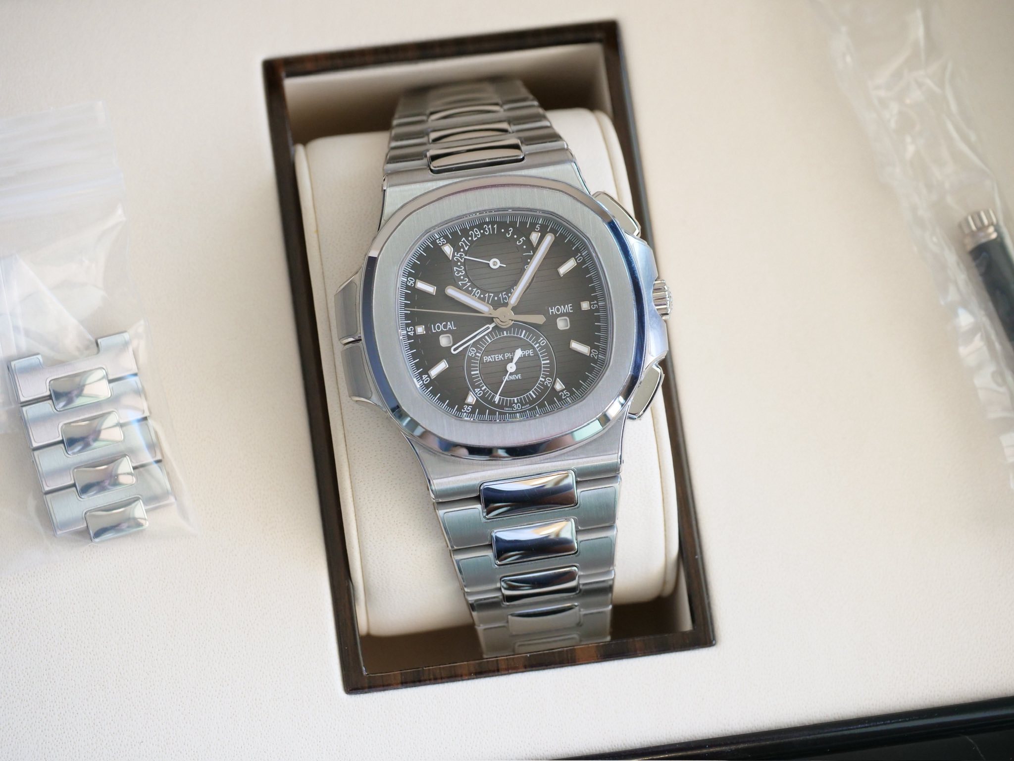 May be an image of wrist watch and text