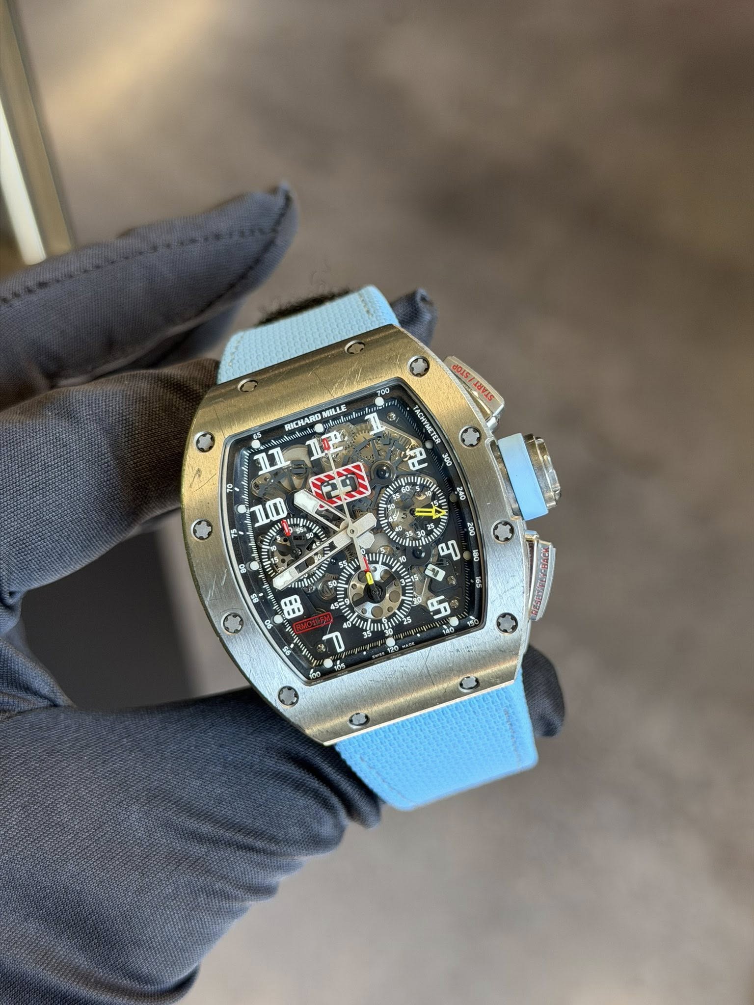 May be an image of wrist watch and text