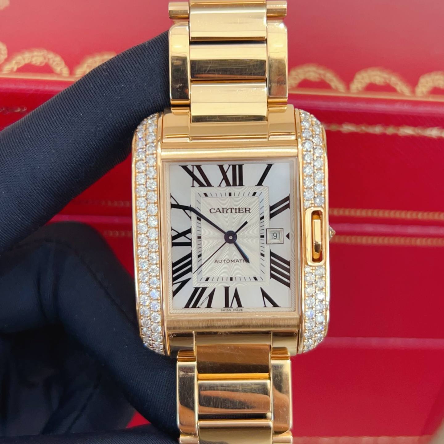 May be an image of wrist watch and text