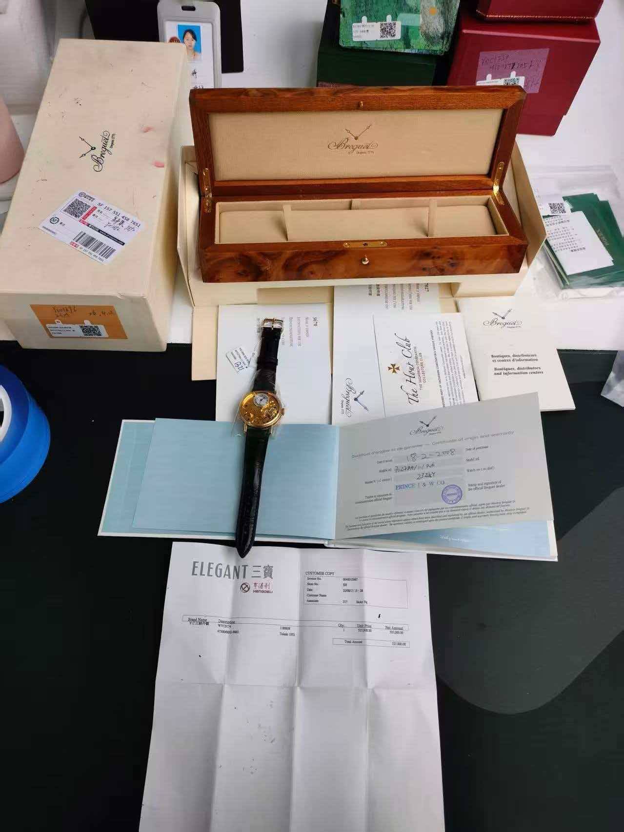 May be an image of fragrance, wrist watch, book and text