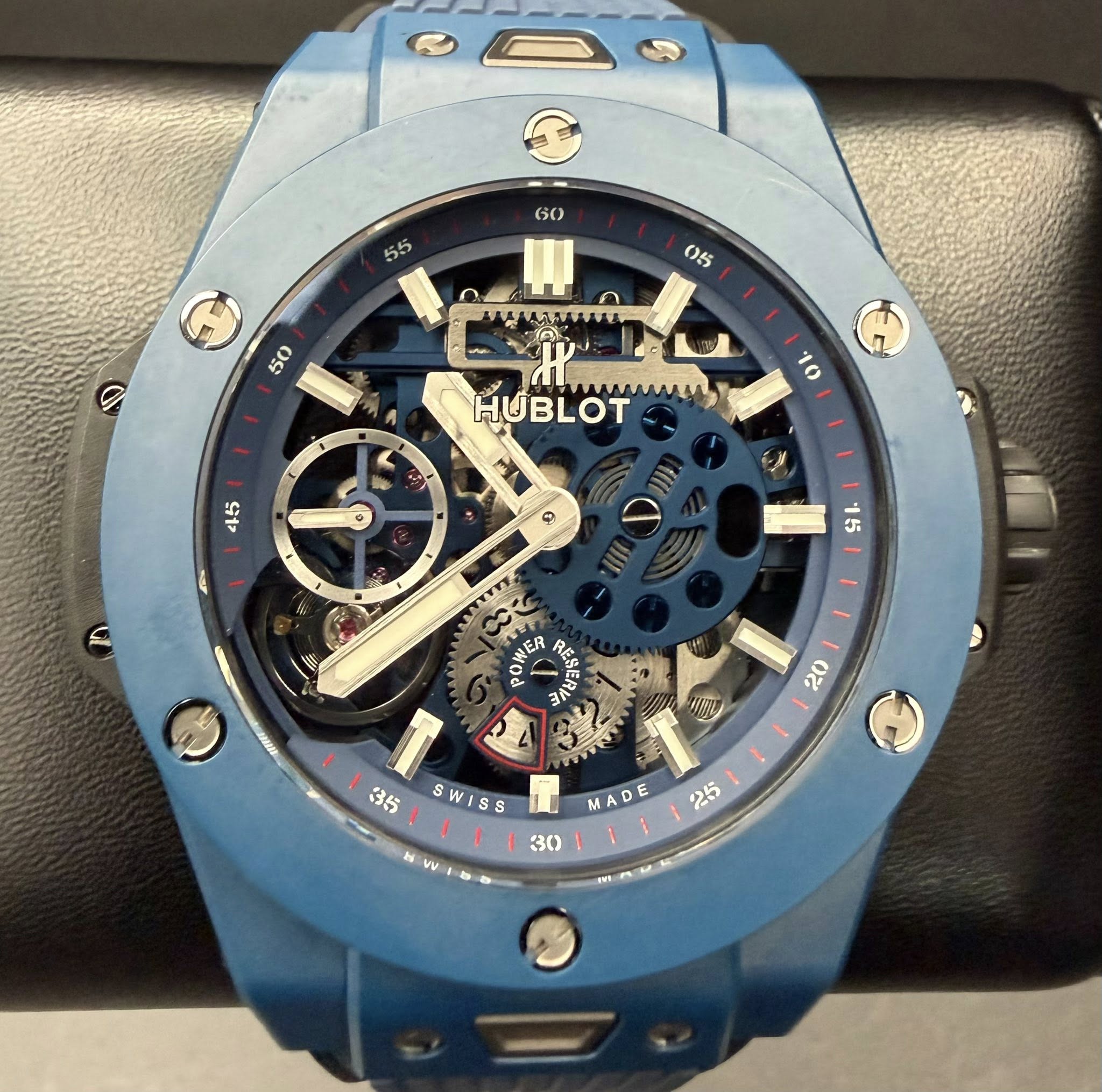 May be an image of wrist watch and text that says ' MMWA HUBLOT mmAWAN 10 45 15 牌 POWER עצמגעו? 20 H ۱ 35 SWISS 30 MADE VV 25'