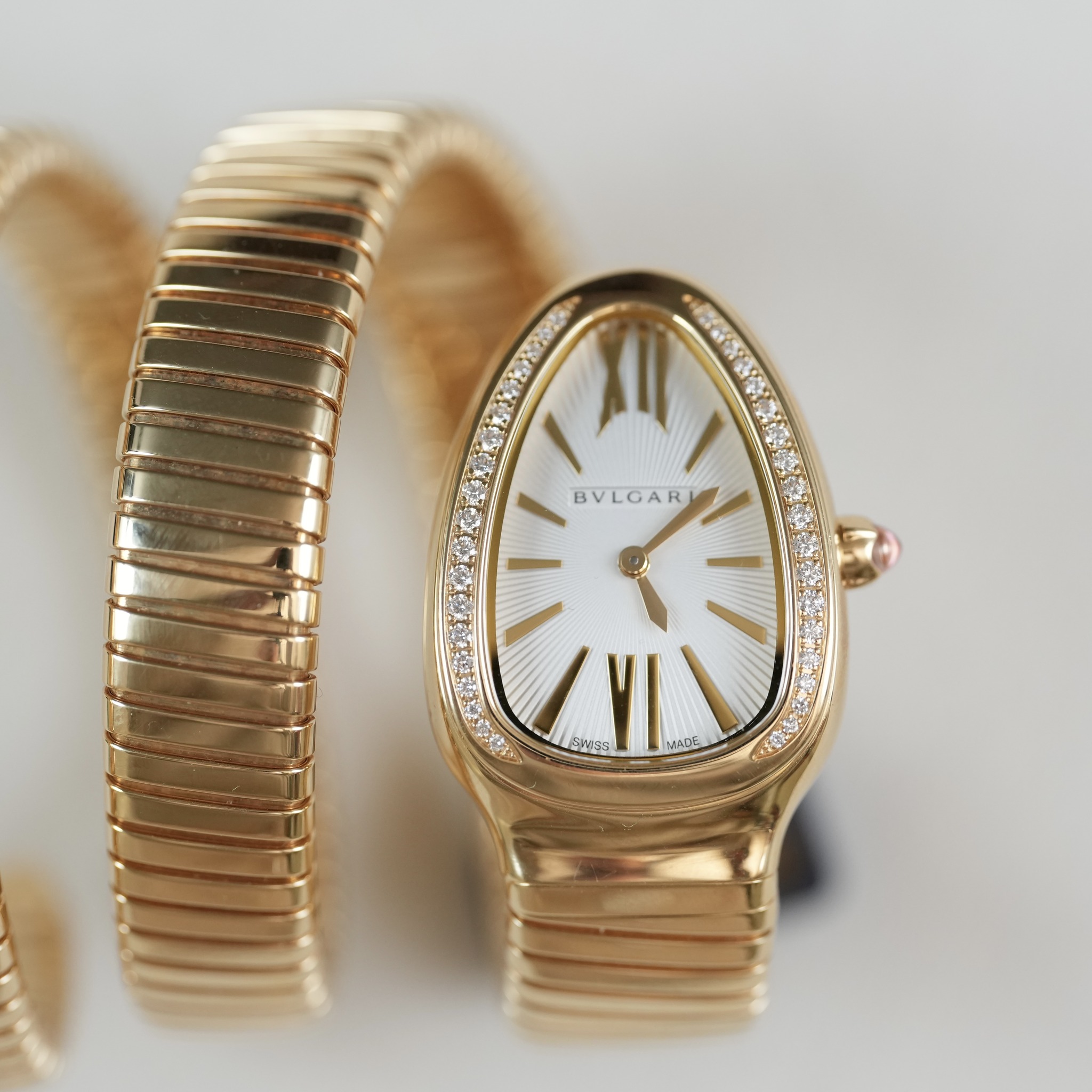 May be an image of wrist watch and jewelry