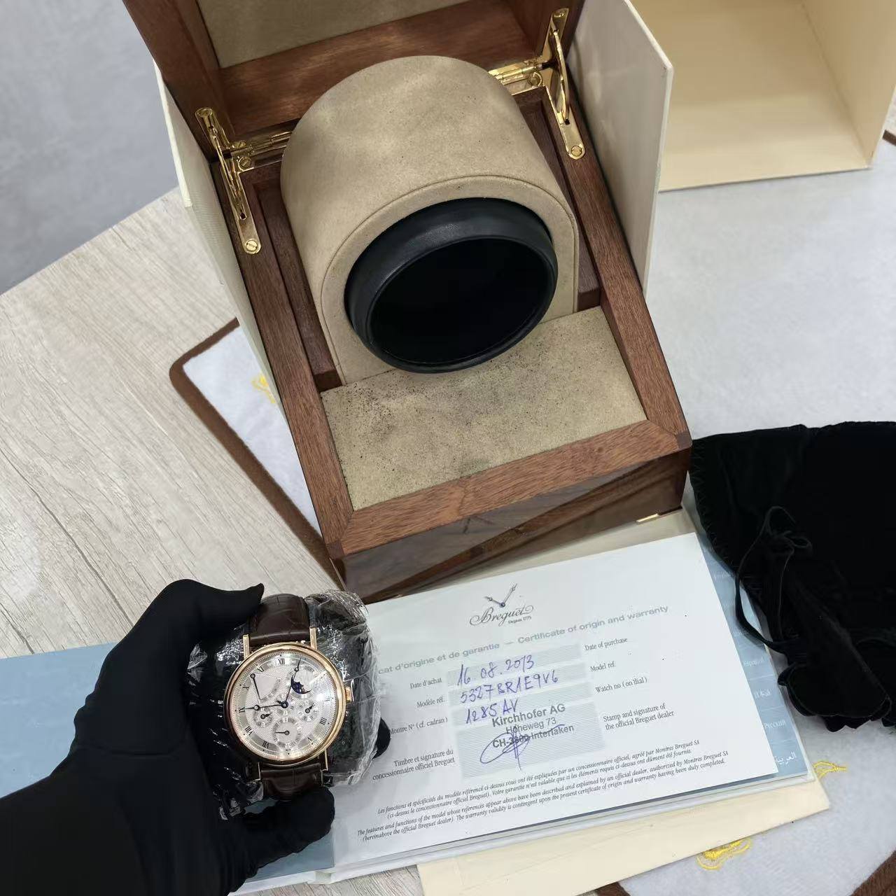 May be an image of wrist watch and text