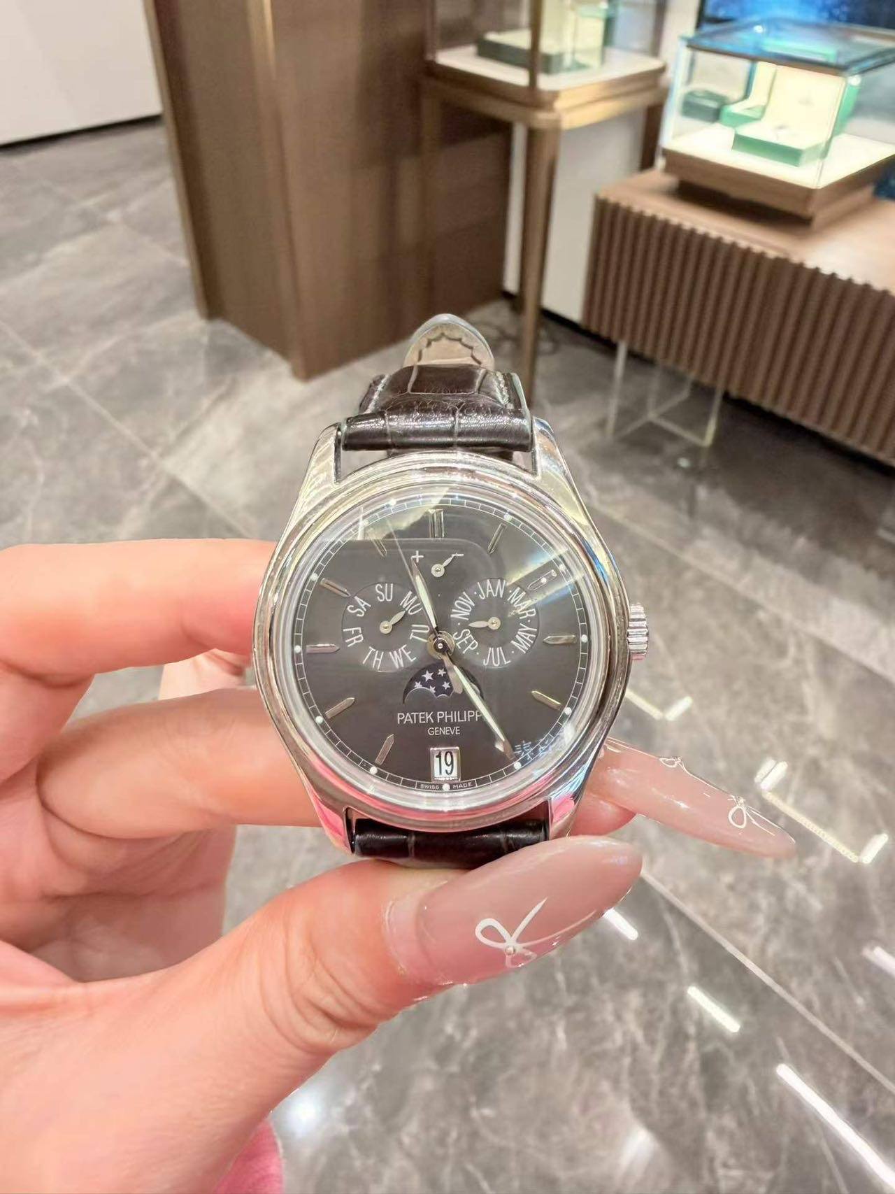 May be an image of wrist watch and text