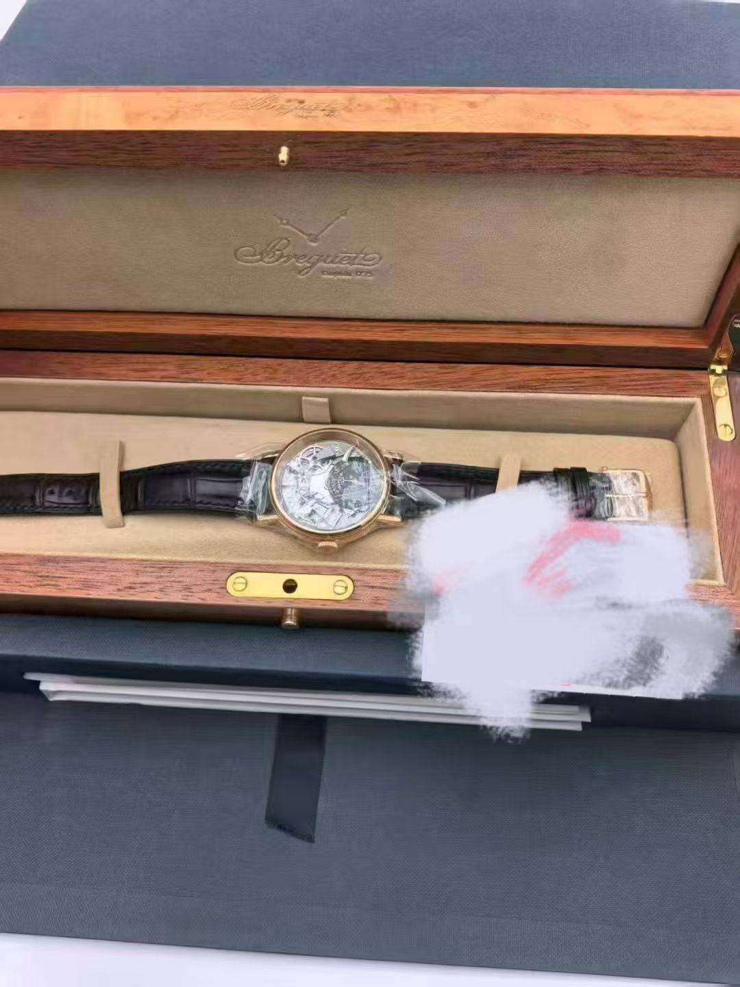 May be an image of wrist watch and text