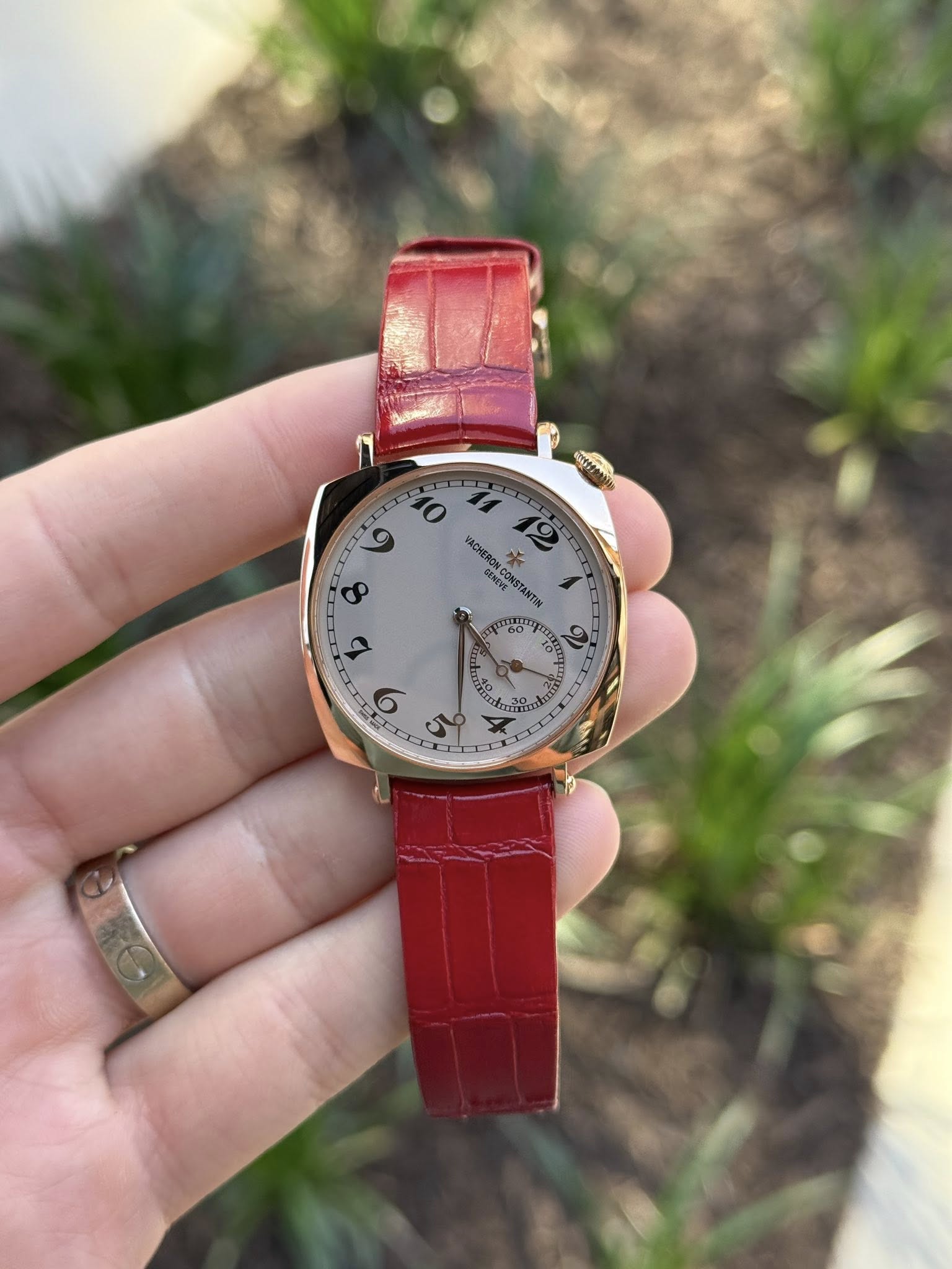 May be an image of wrist watch and text