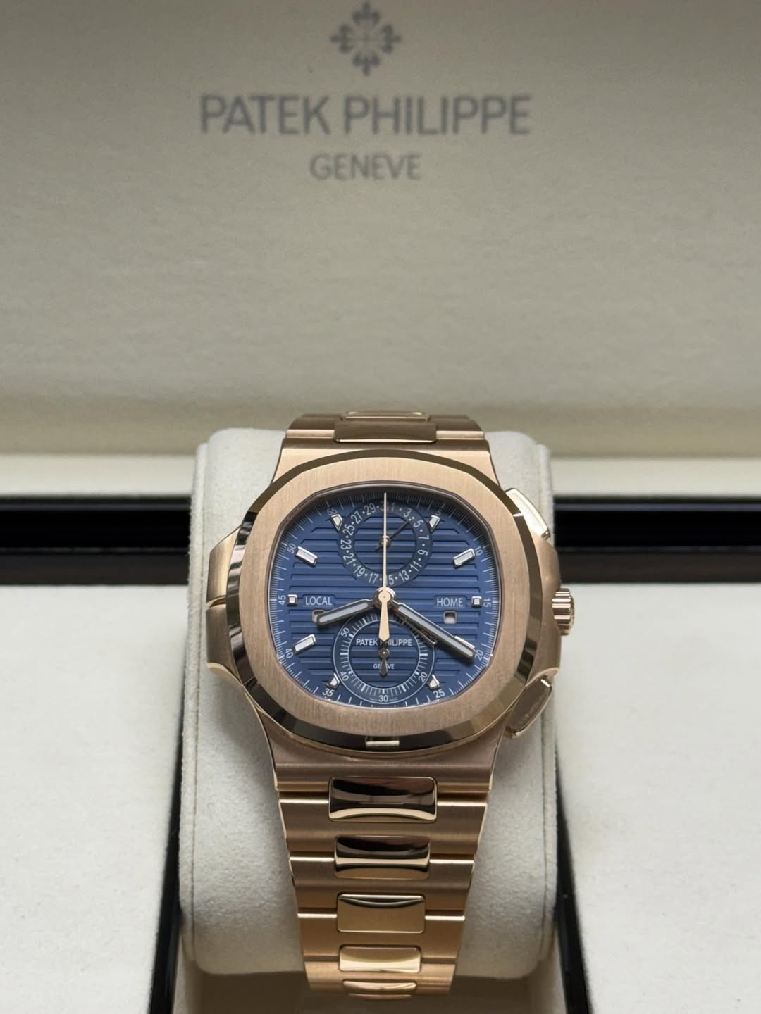 May be an image of wrist watch and text that says 'PATEK PHILIPPE GENEVE ት . T LOCAL HOME ম 六 5 PATEK PPE A5'