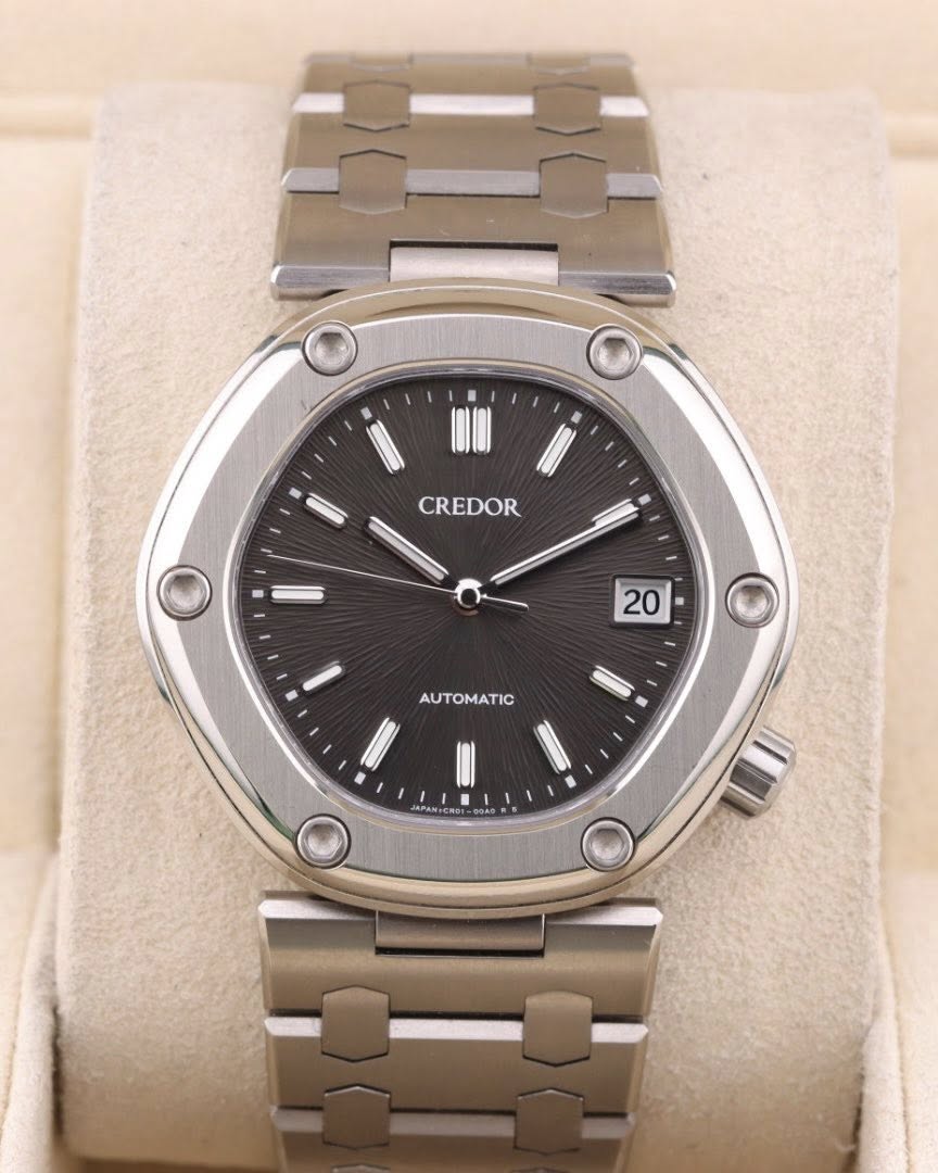 May be an image of wrist watch and text that says 'CREDOR 20 AUTOMATIC'