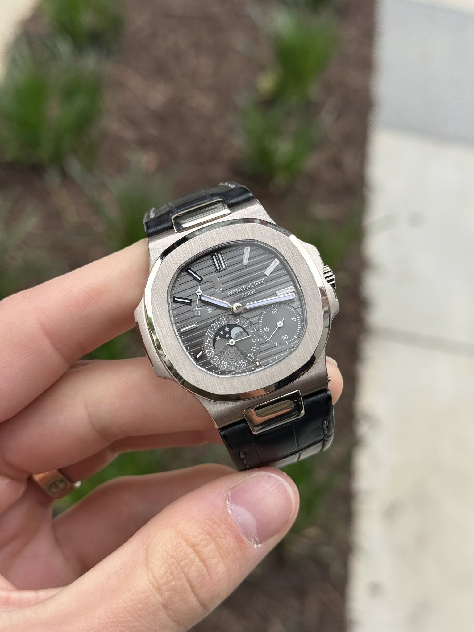 May be an image of wrist watch and text