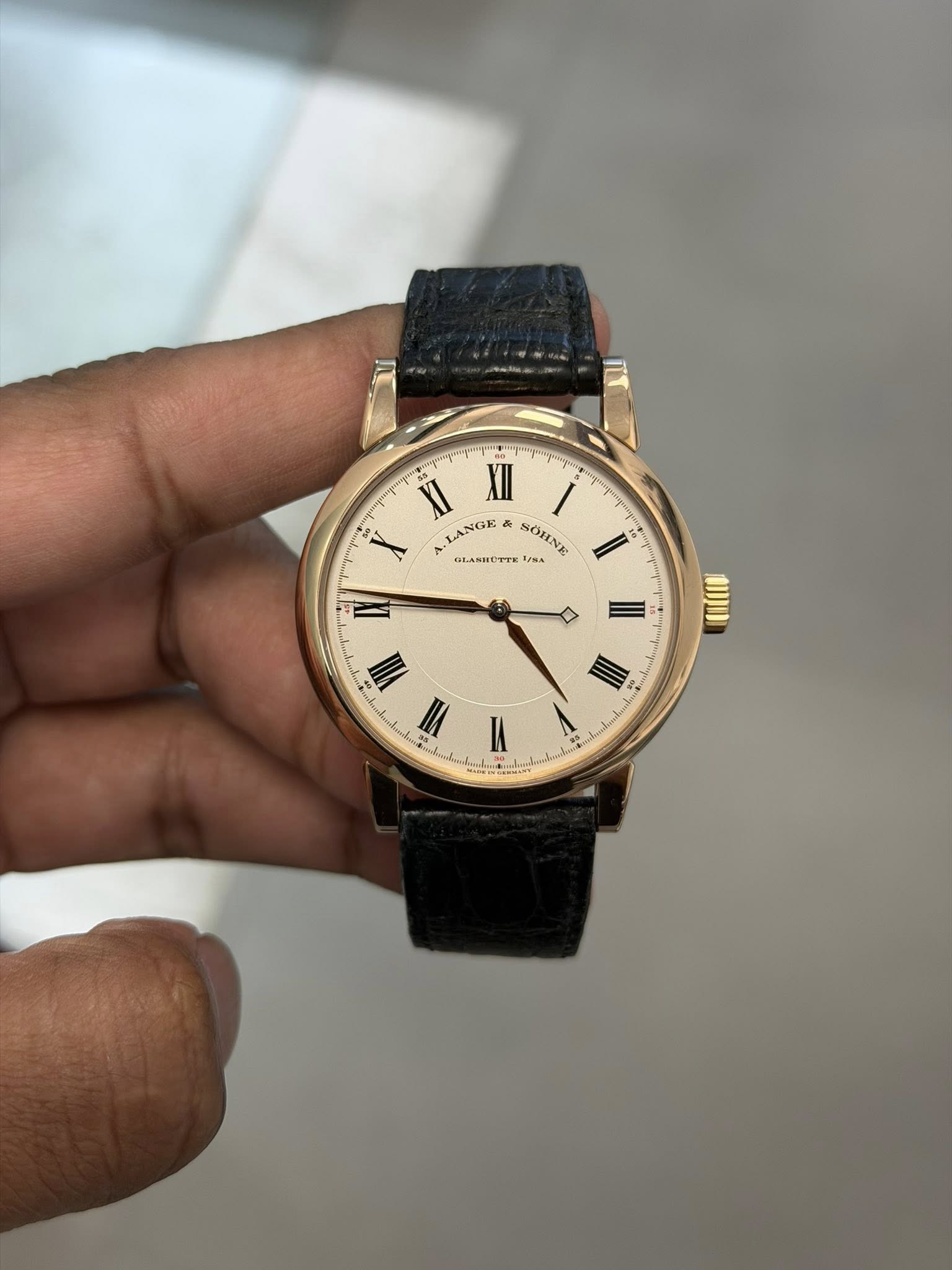 May be an image of wrist watch and text