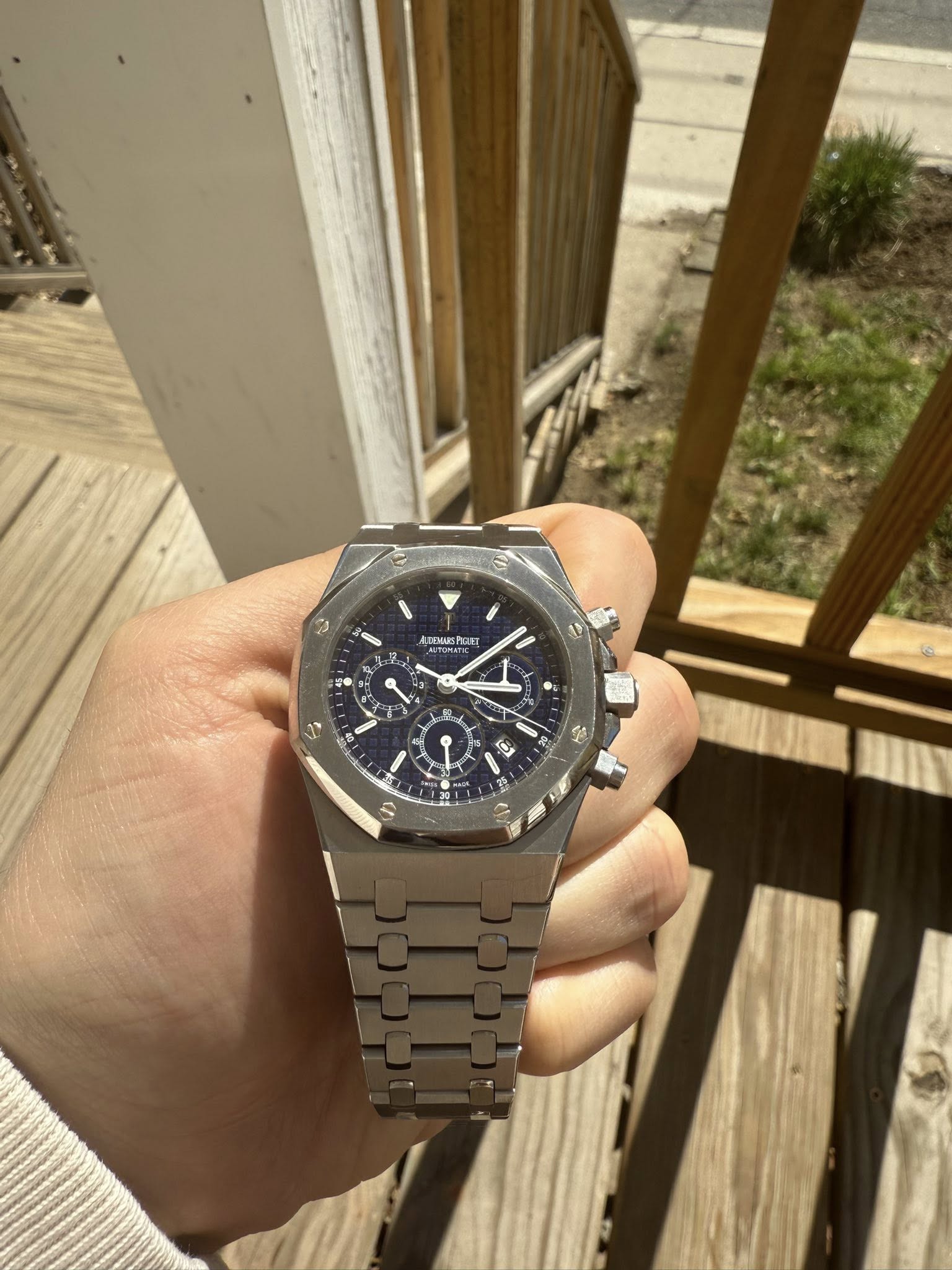 May be an image of wrist watch and text