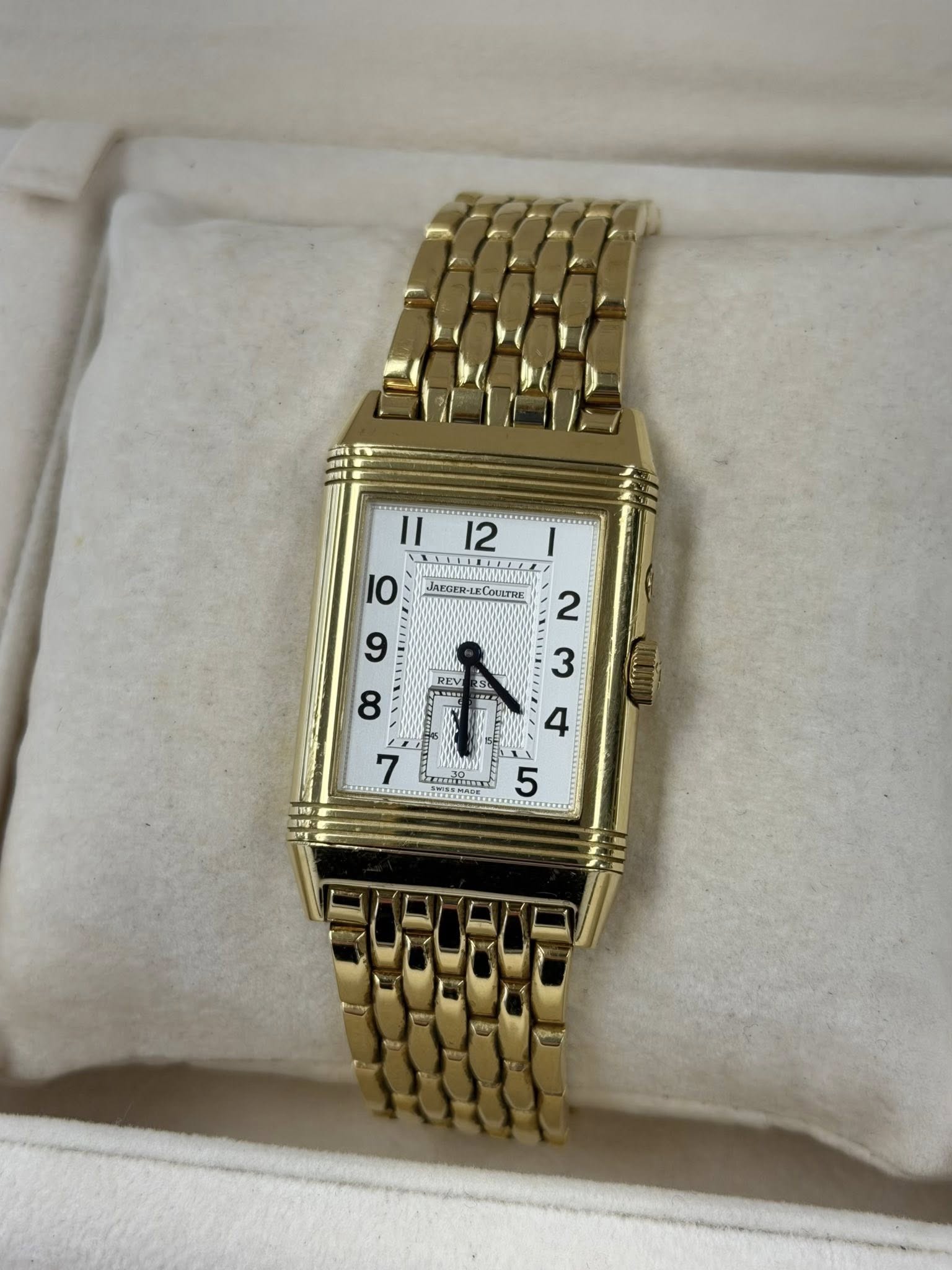May be an image of wrist watch and text