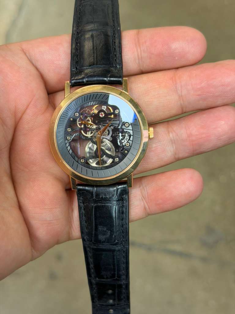 May be an image of wrist watch and text