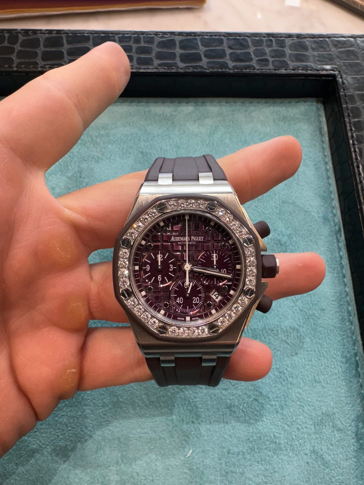 May be an image of wrist watch and text