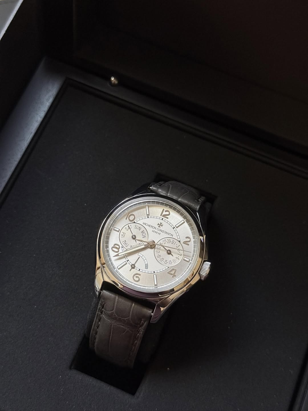 May be an image of wrist watch and text