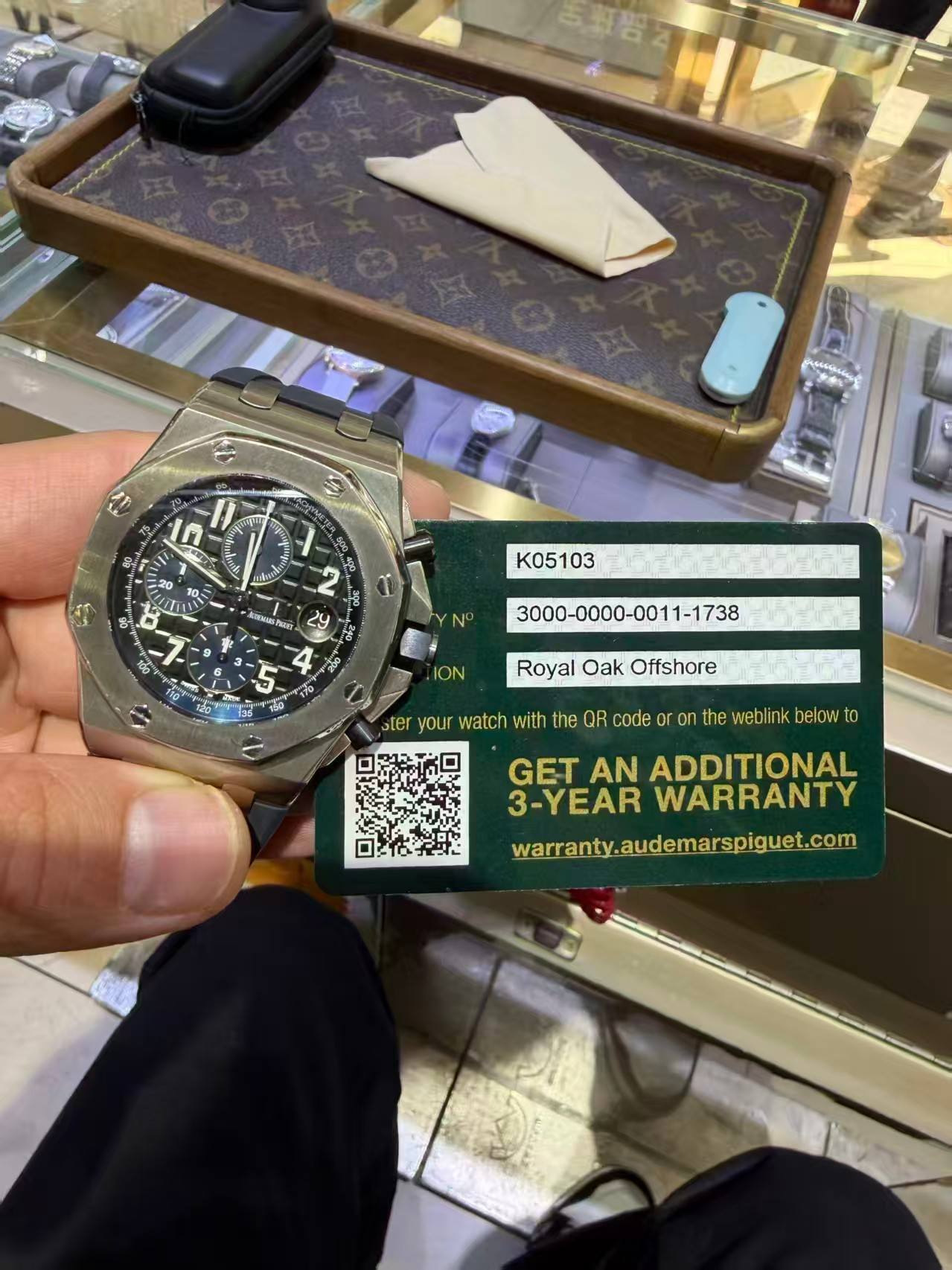 May be an image of wrist watch and text that says '百鮮岩本 די 王 A M သိ် 10~ K05103 ION Royal Oak Offshore ster your watch with the QR code o on the weblink below to GET AN…