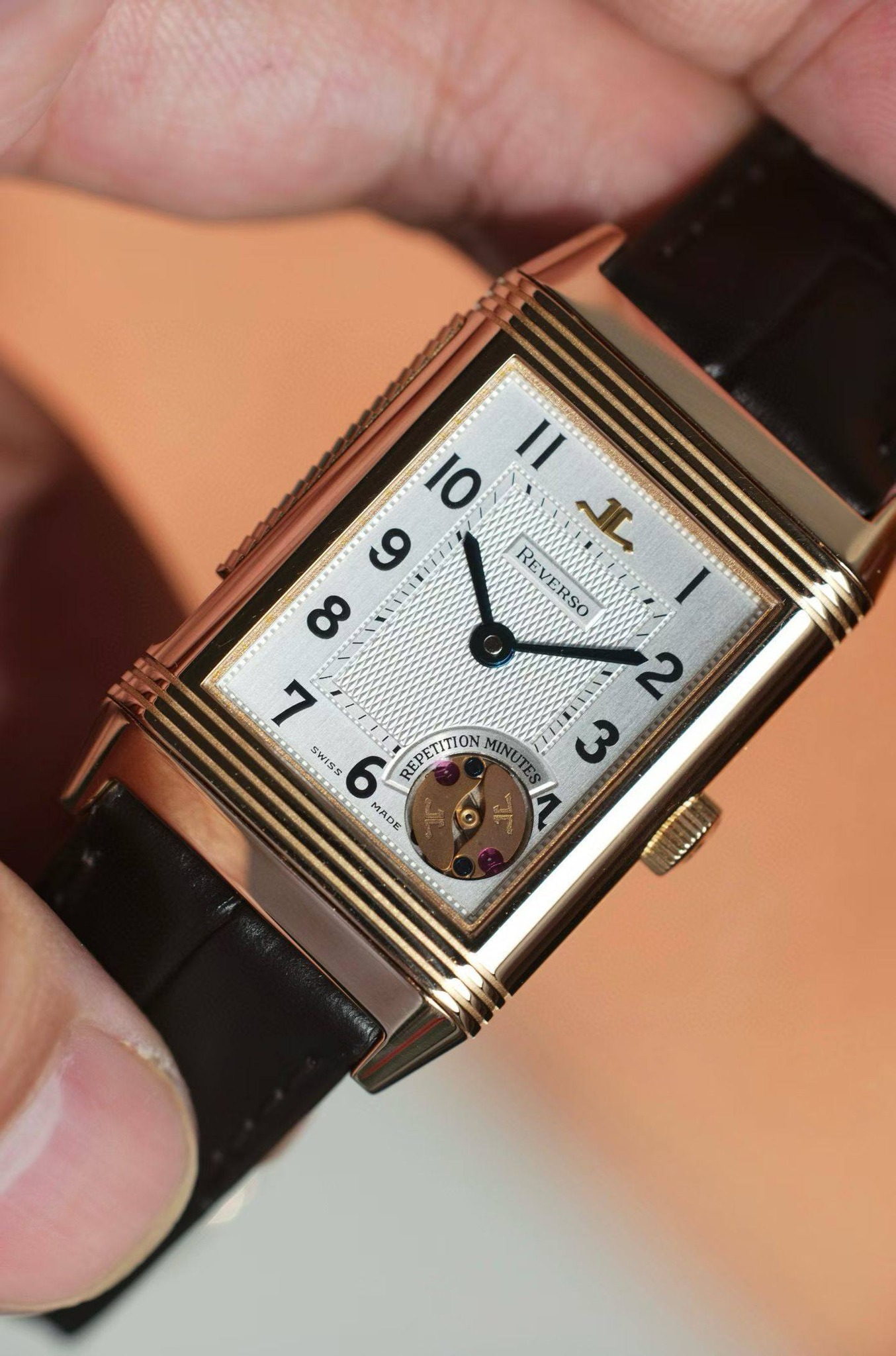 May be an image of wrist watch and text