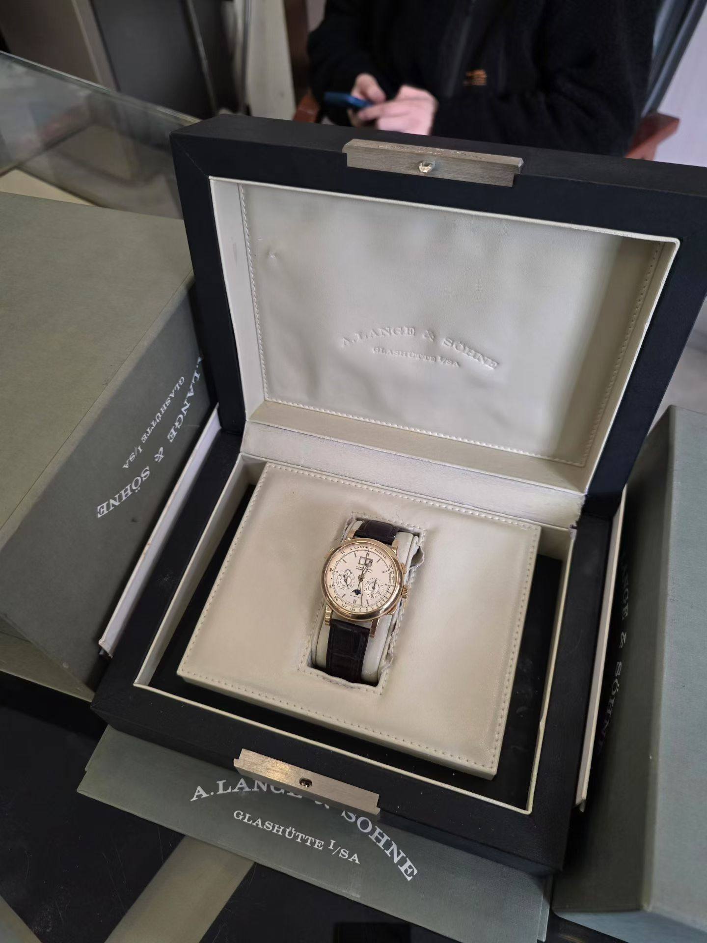 May be an image of wrist watch and text