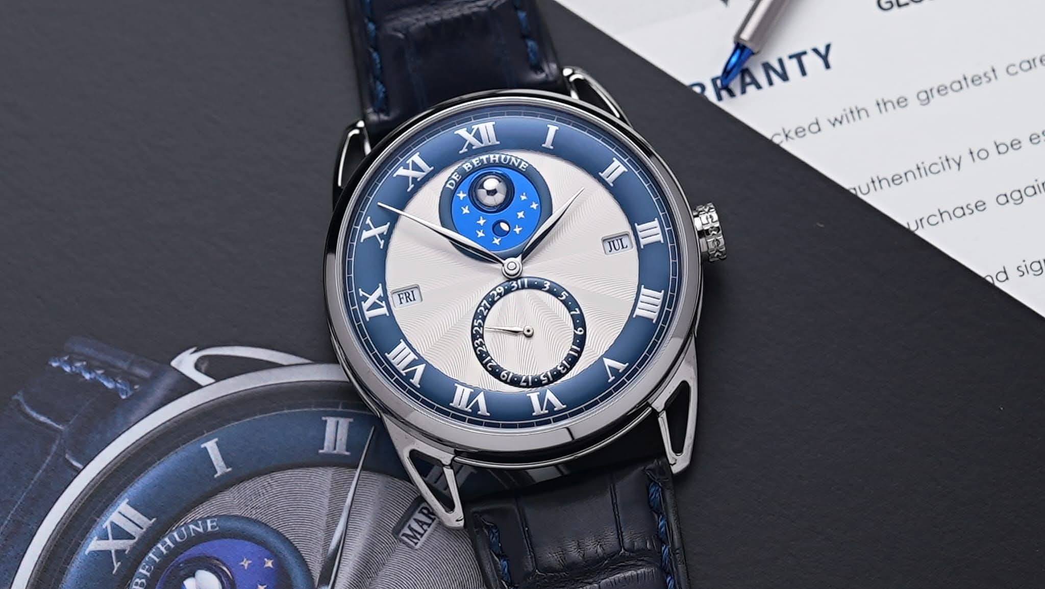 May be an image of wrist watch and text that says 'XII I XI DE BETHUNE X x n v KANTY cked with the greatest car uthenticity to be again urchase JUL អុច្ករះស្ទ S አን O ٥ IIII IX…