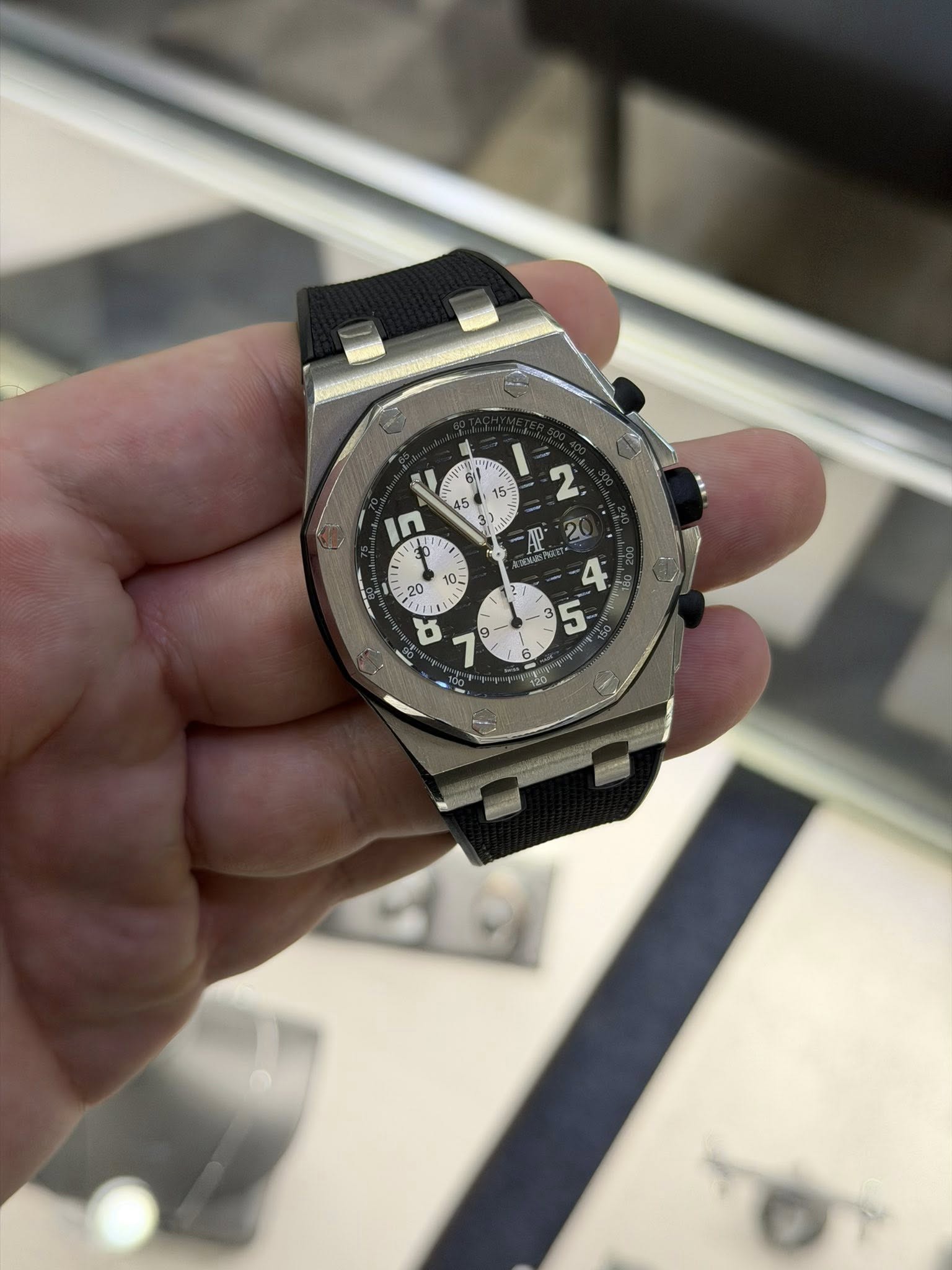 May be an image of wrist watch and text
