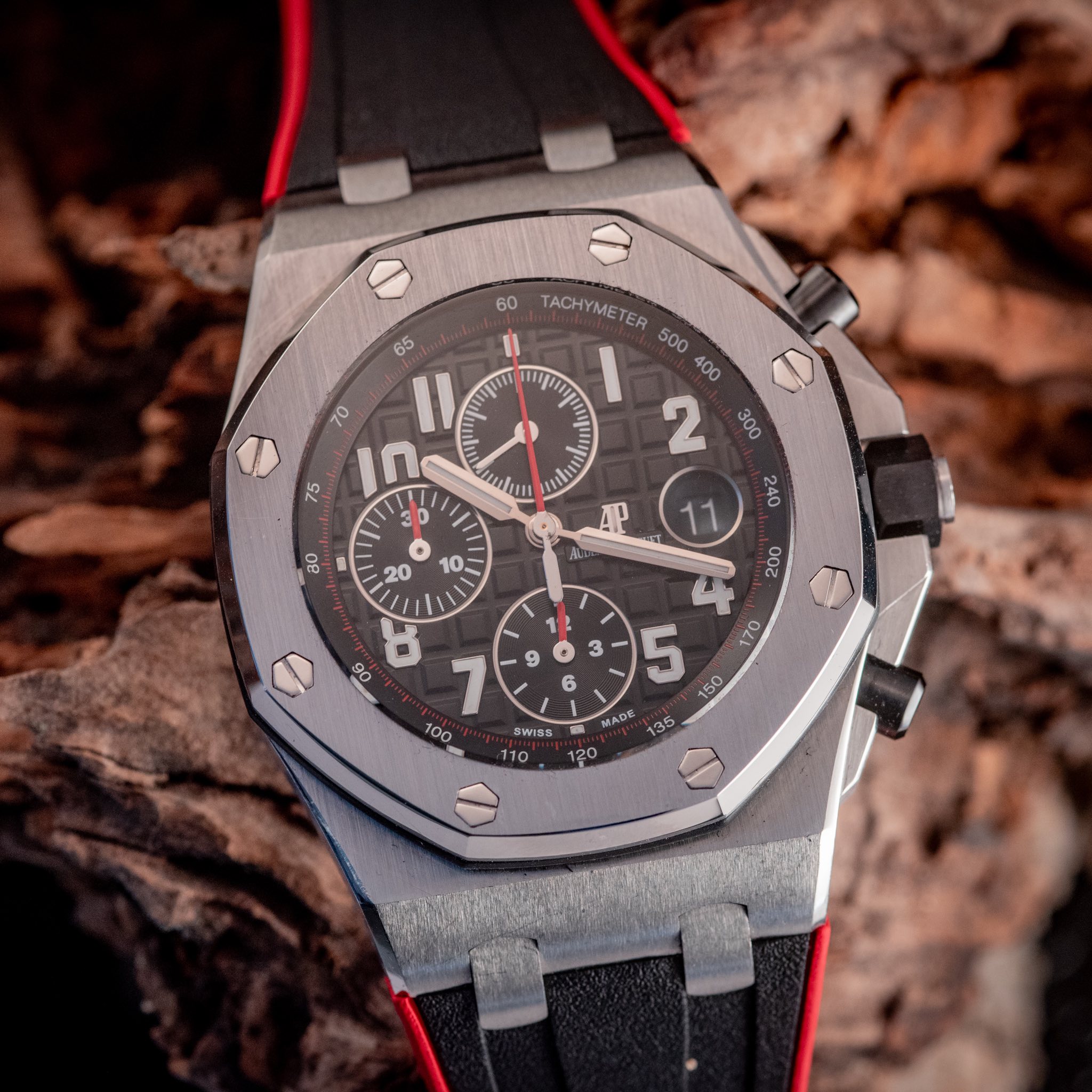May be an image of wrist watch and text that says '65 70 חן 3 II in 1II m mlues uhm AP 60 TACHYMETER • SWISS 5 150 AAE '