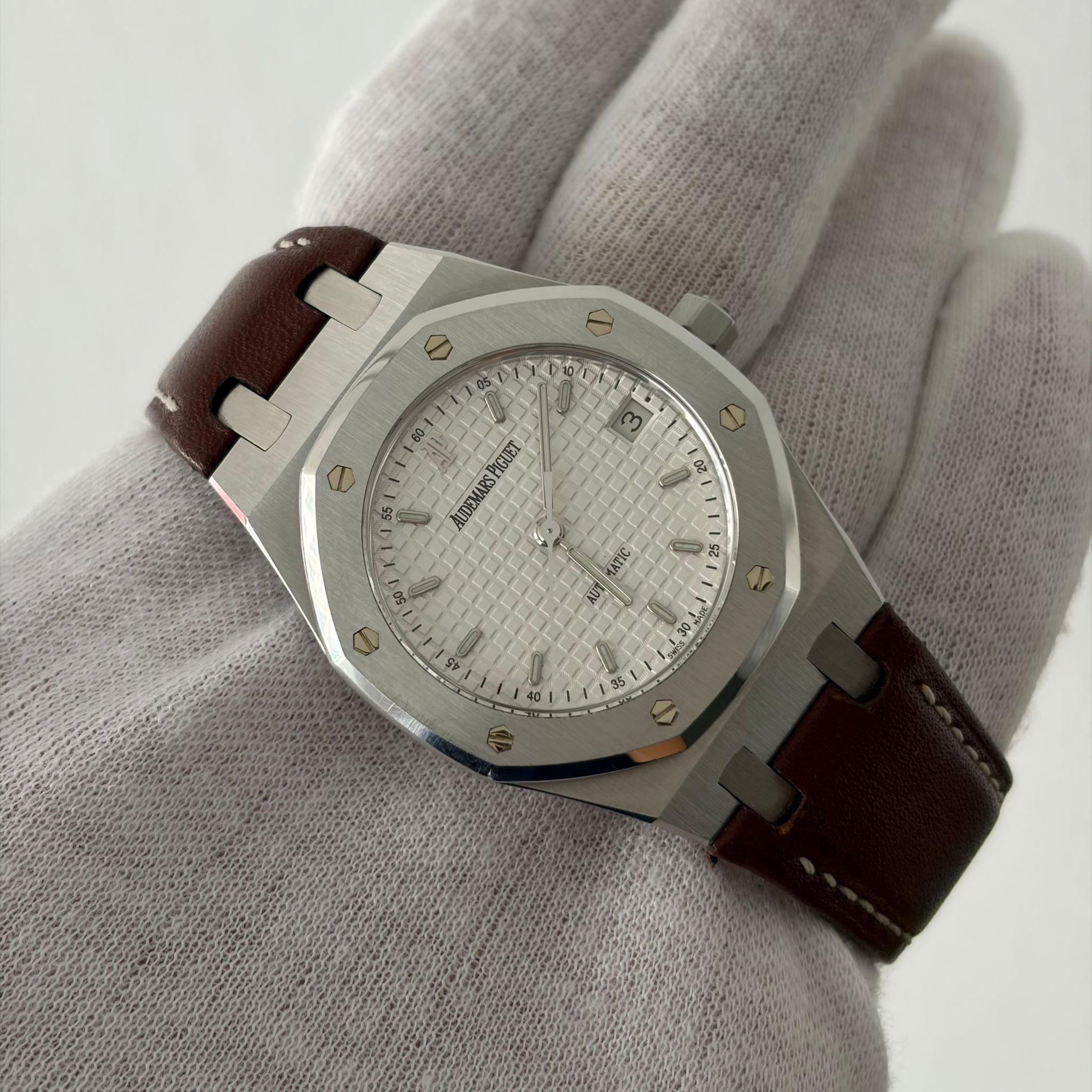 May be an image of wrist watch and text