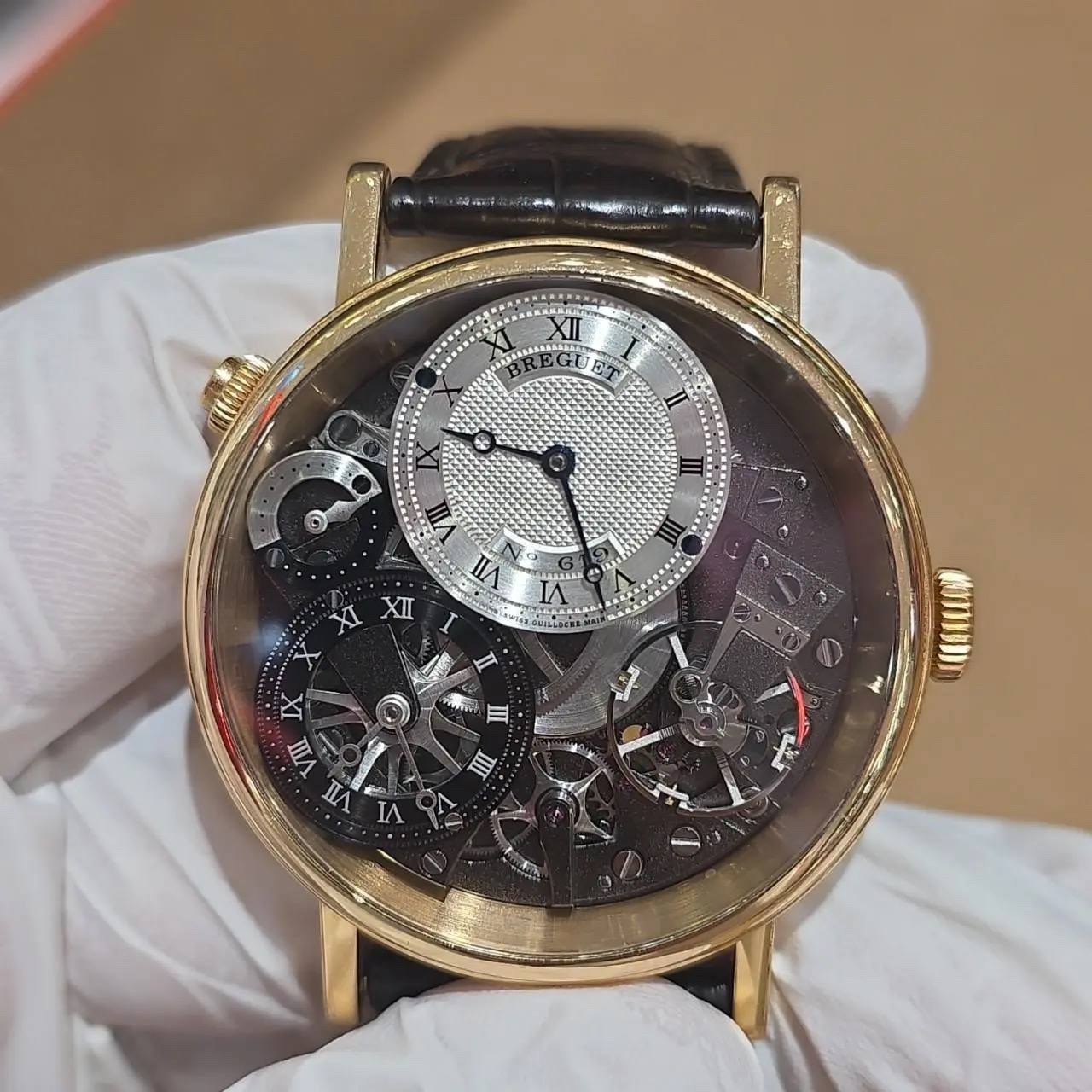 May be an image of wrist watch and text