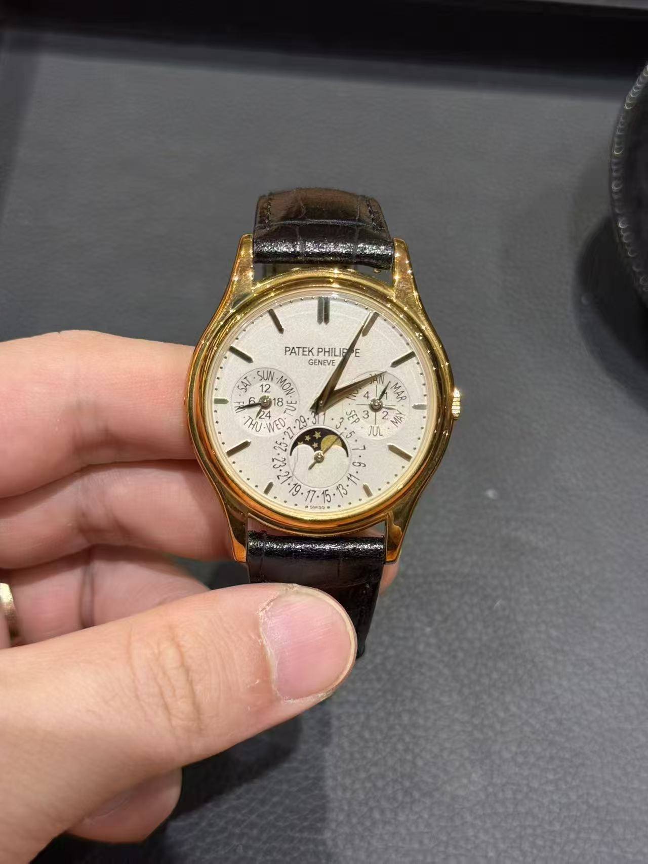 May be an image of wrist watch and text