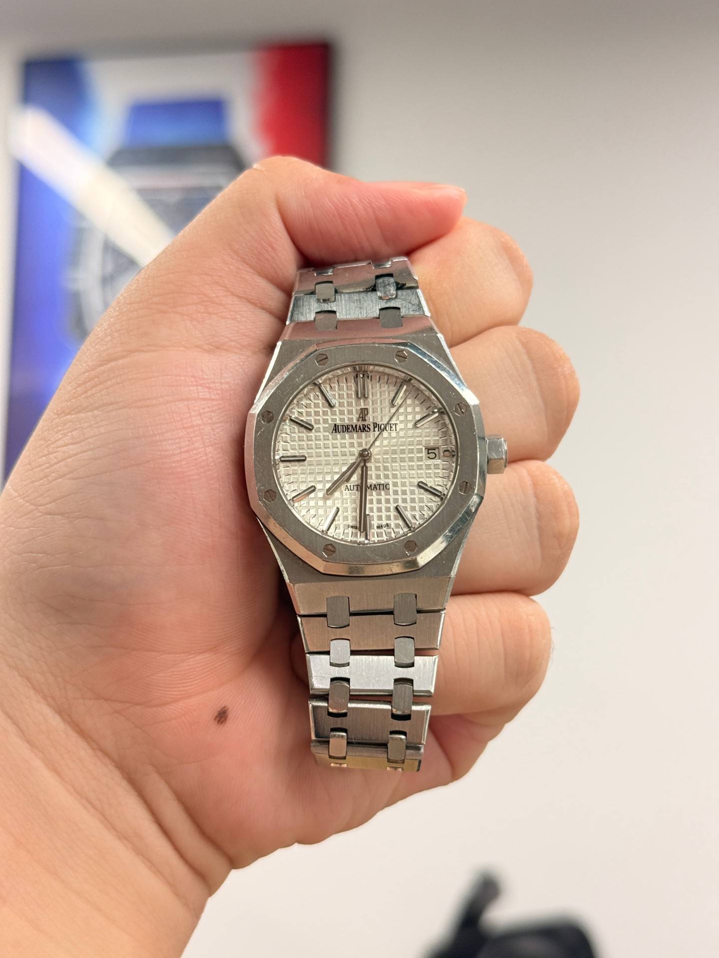 May be an image of wrist watch and text