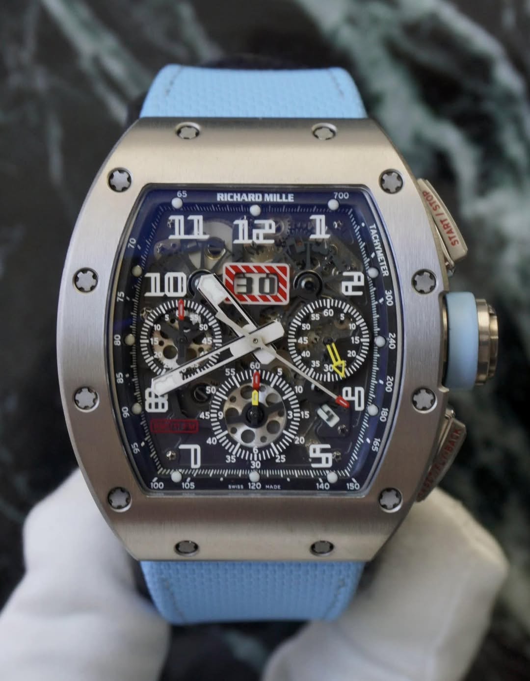 May be an image of wrist watch and text
