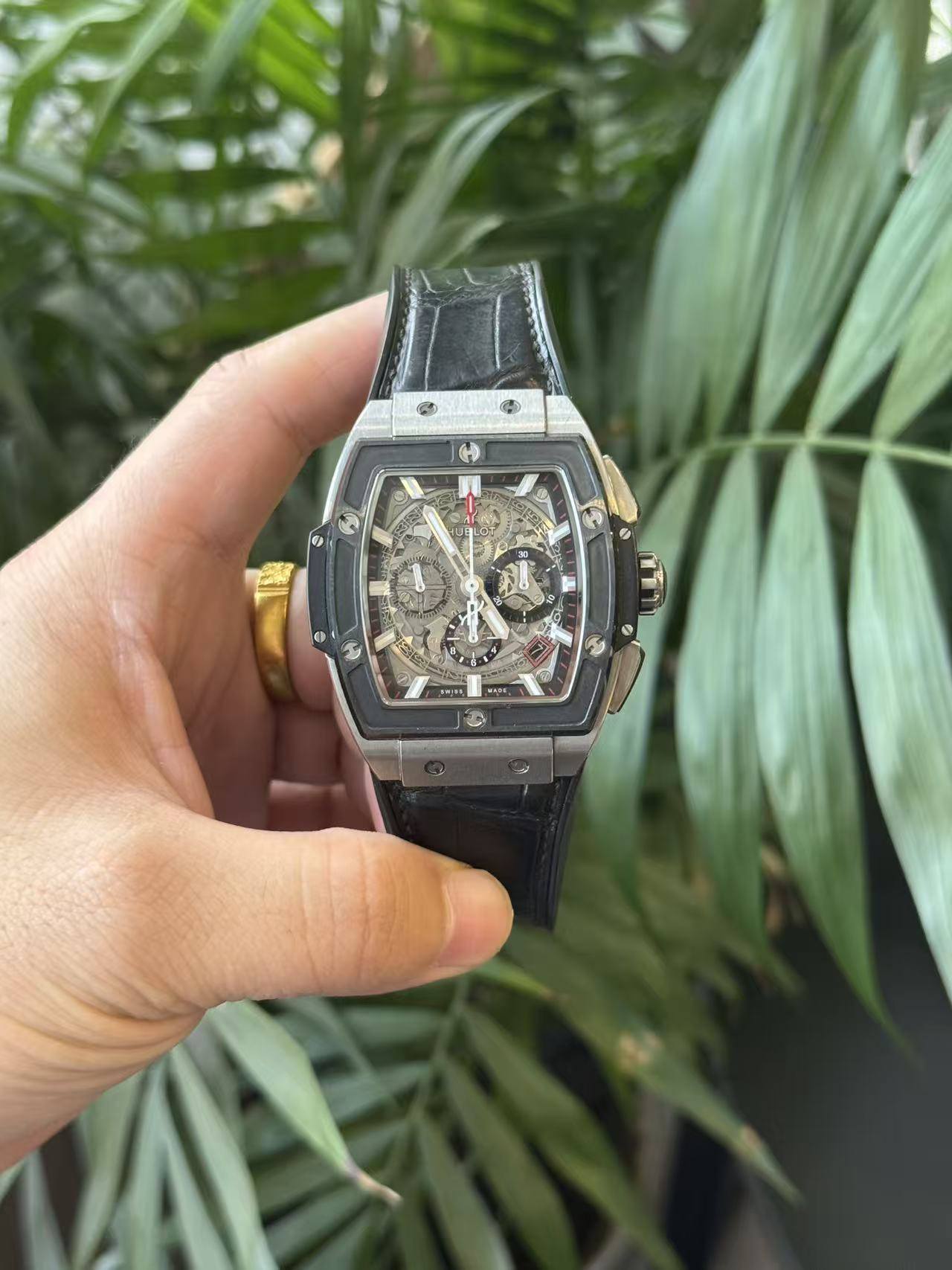 May be an image of wrist watch and text