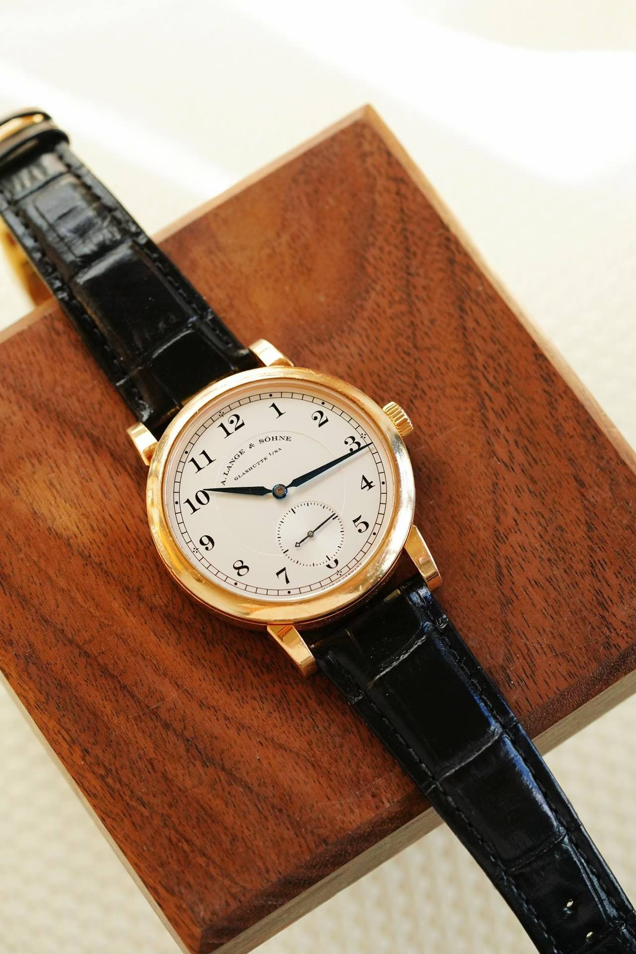 May be an image of wrist watch and text
