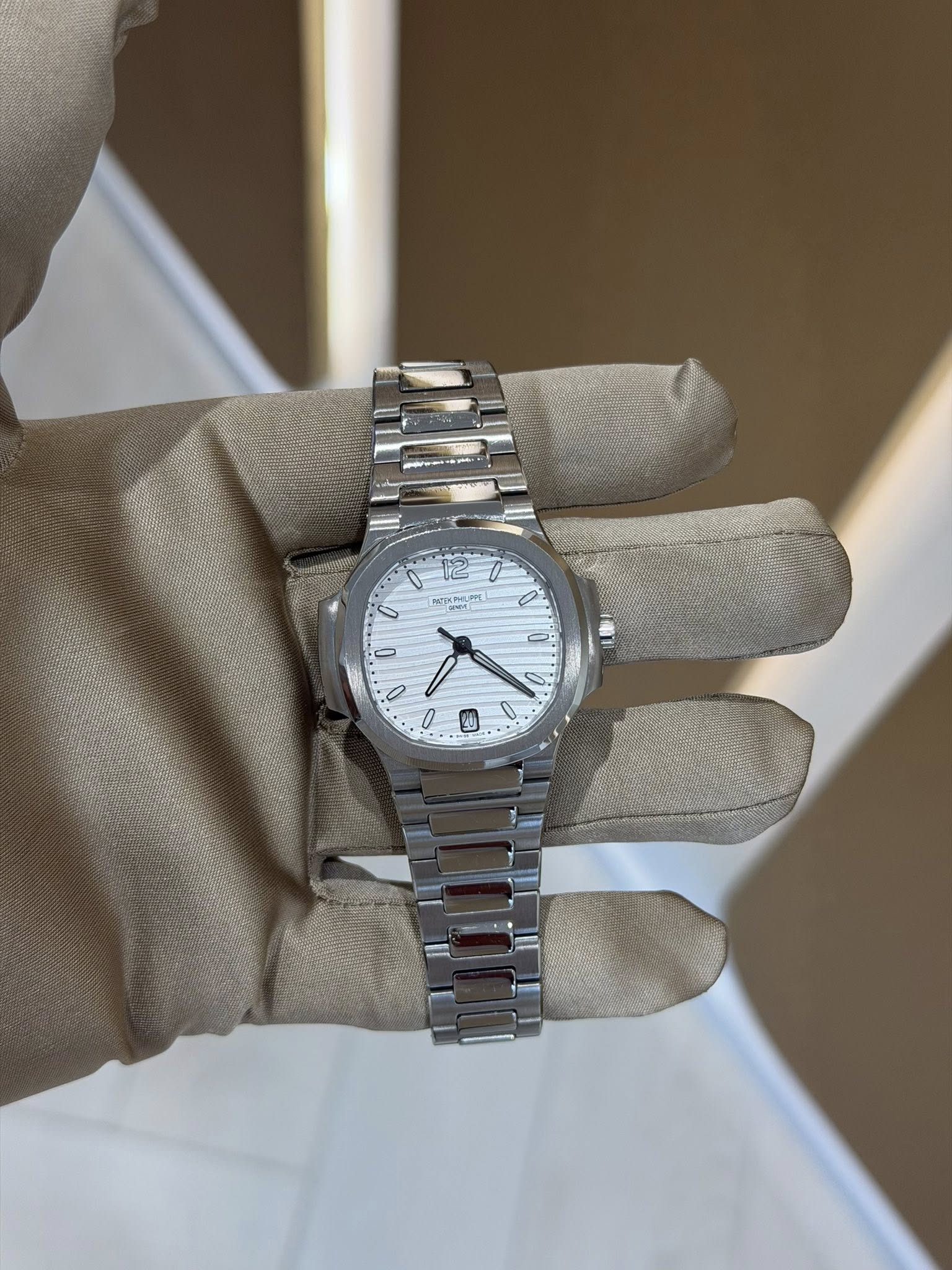 May be an image of wrist watch and text